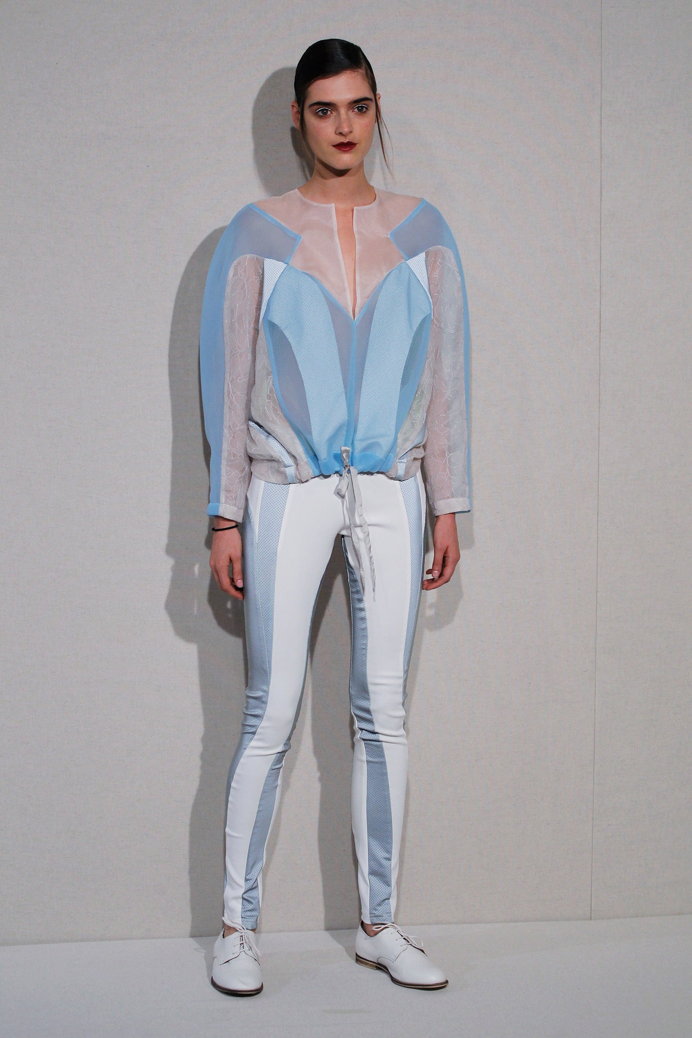 blue and white fitted top with slim pants