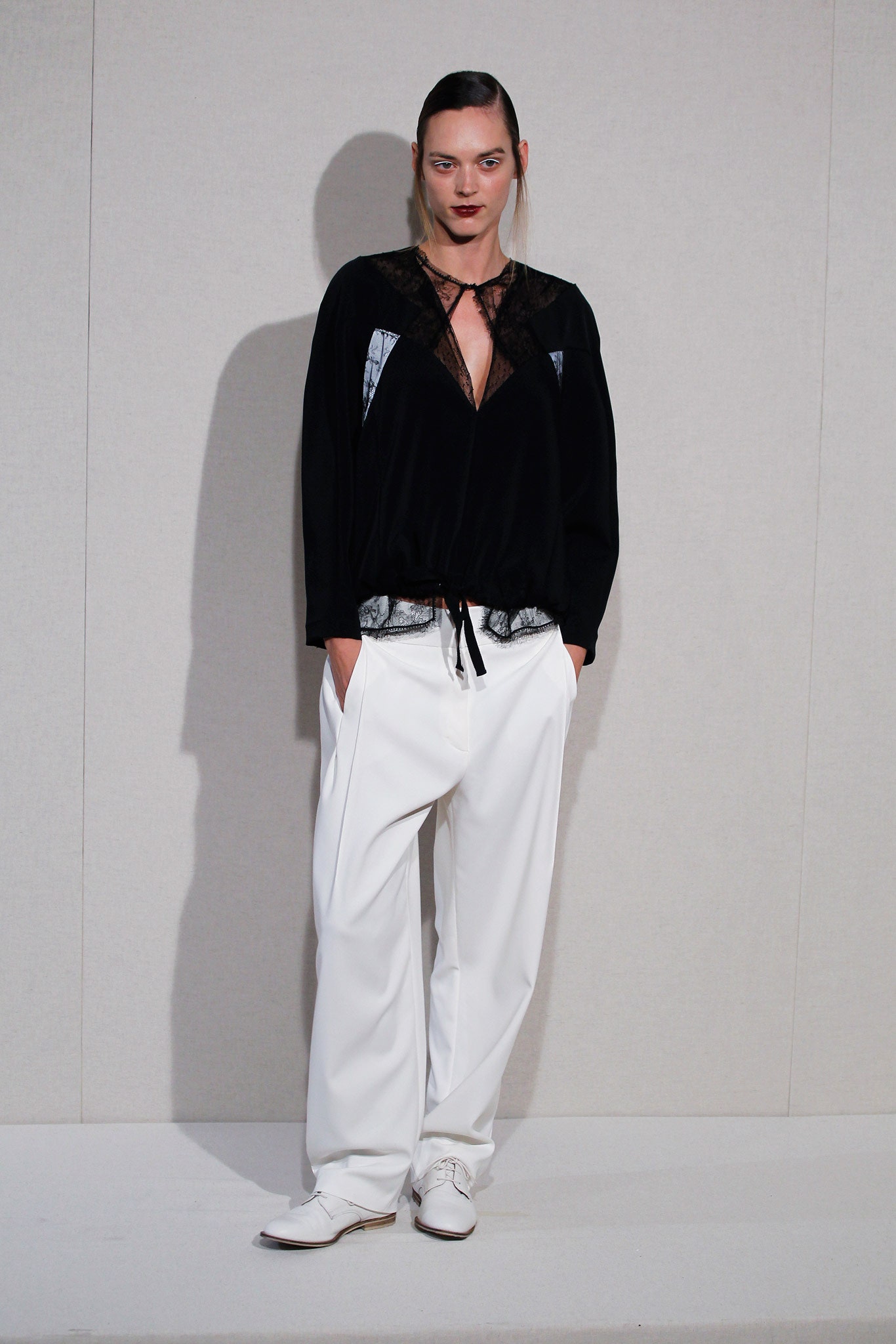 black silk relaxed top and white pants