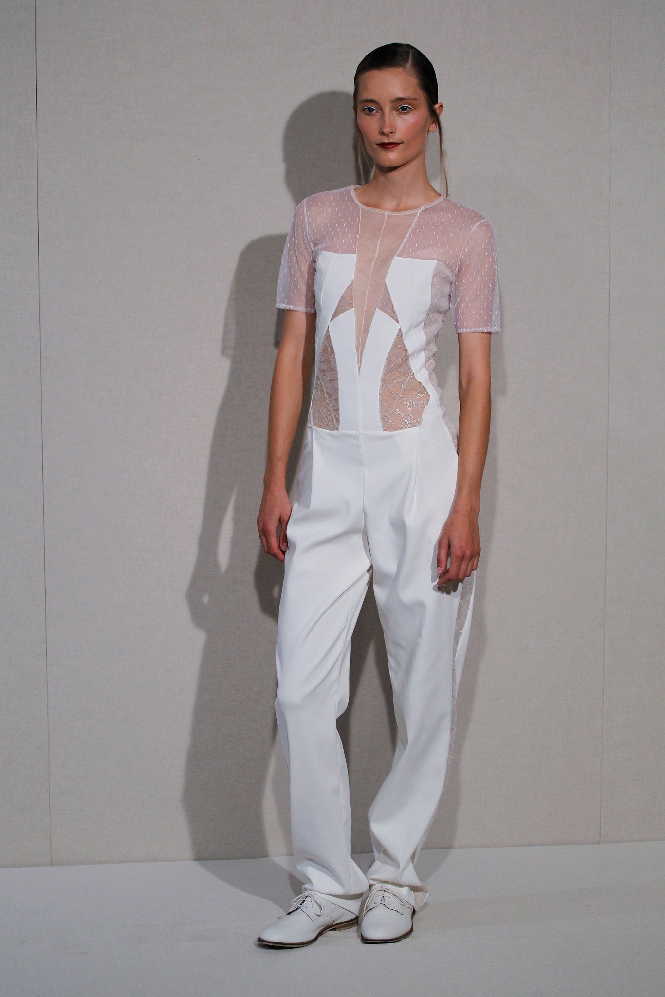 white fitted jumpsuit with sheer details