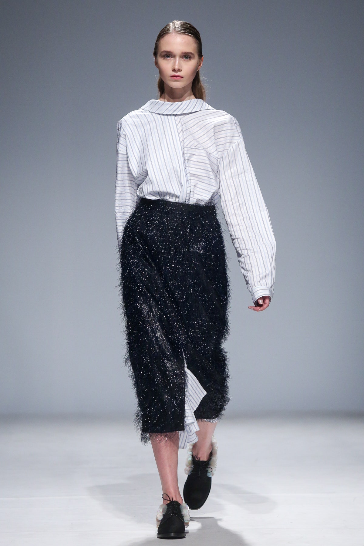 striped shirt and black skirt