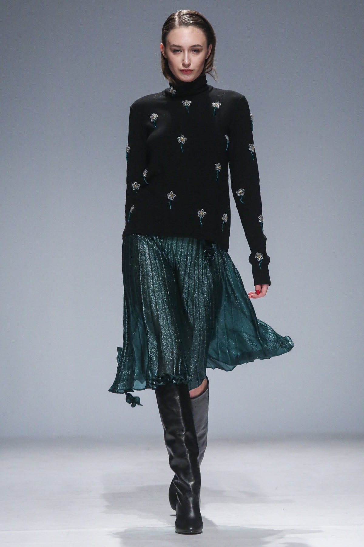black embroidered top with green skirt