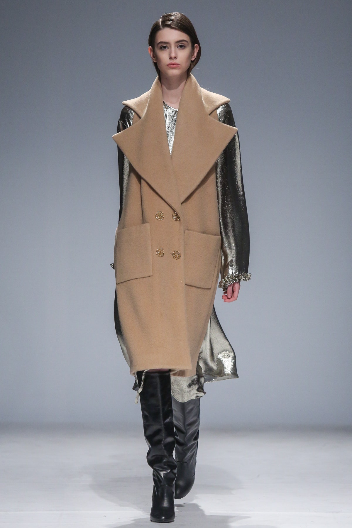 beige wool coat and silver dress