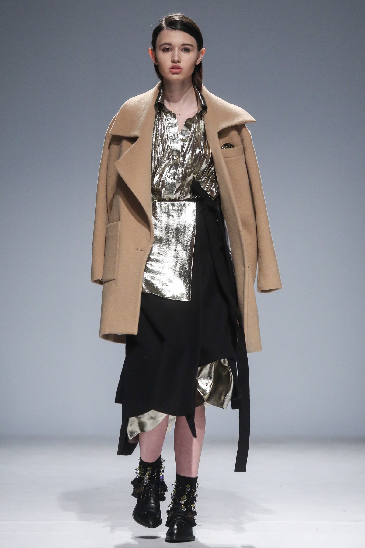 beige wool coat with black gold dress