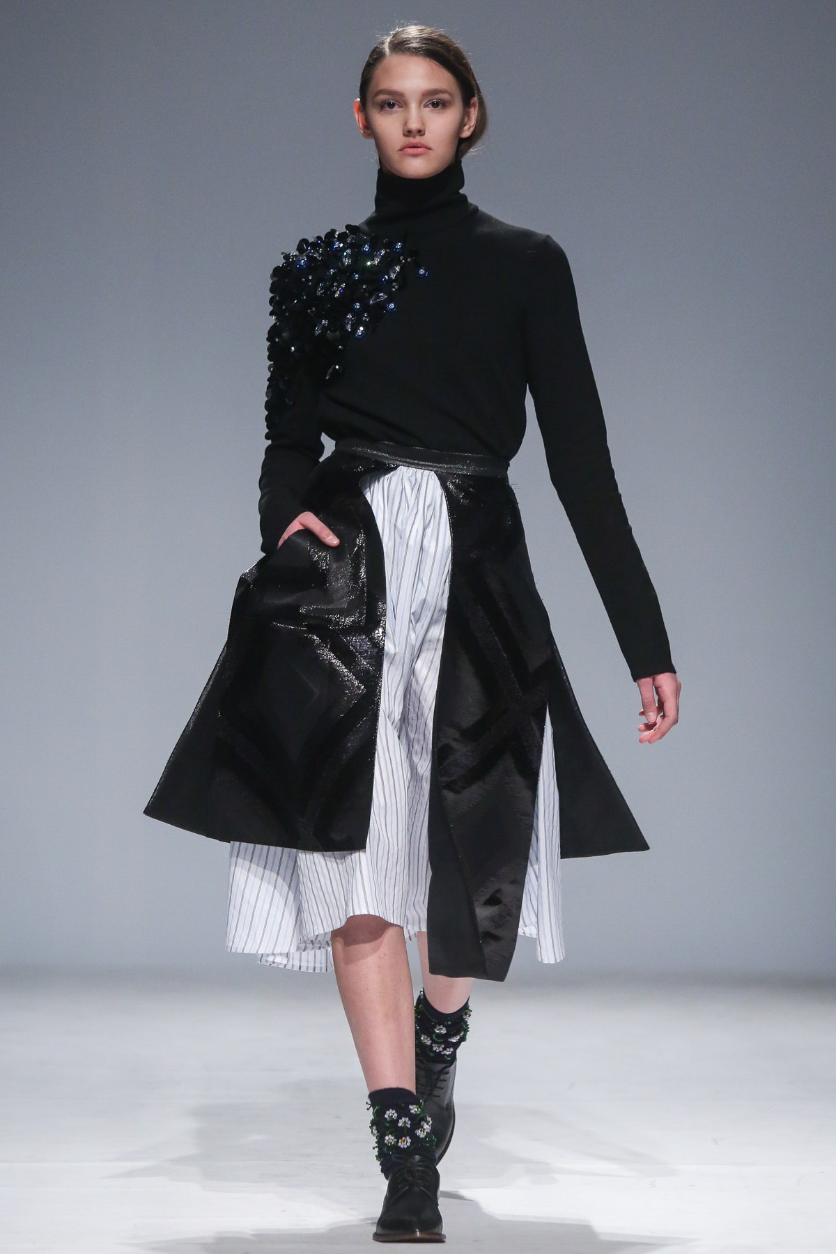 black embellished top with asymmetric skirt