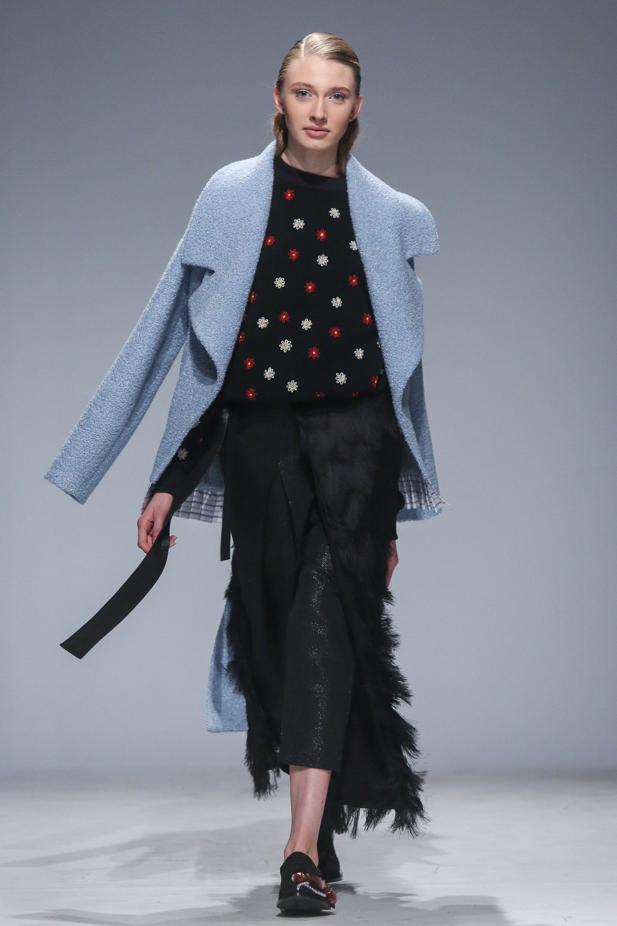 blue wool coat black sweater black skirt