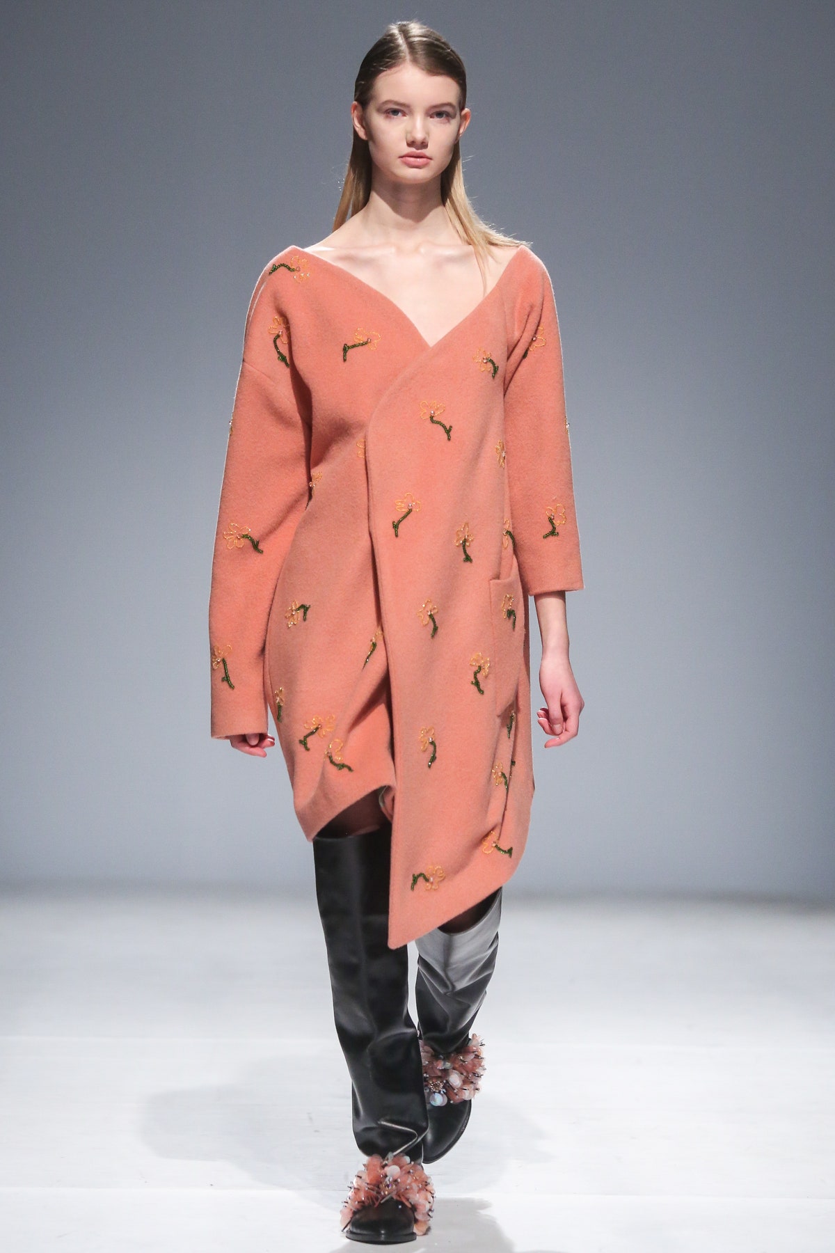 pink wool draped coat with black pants