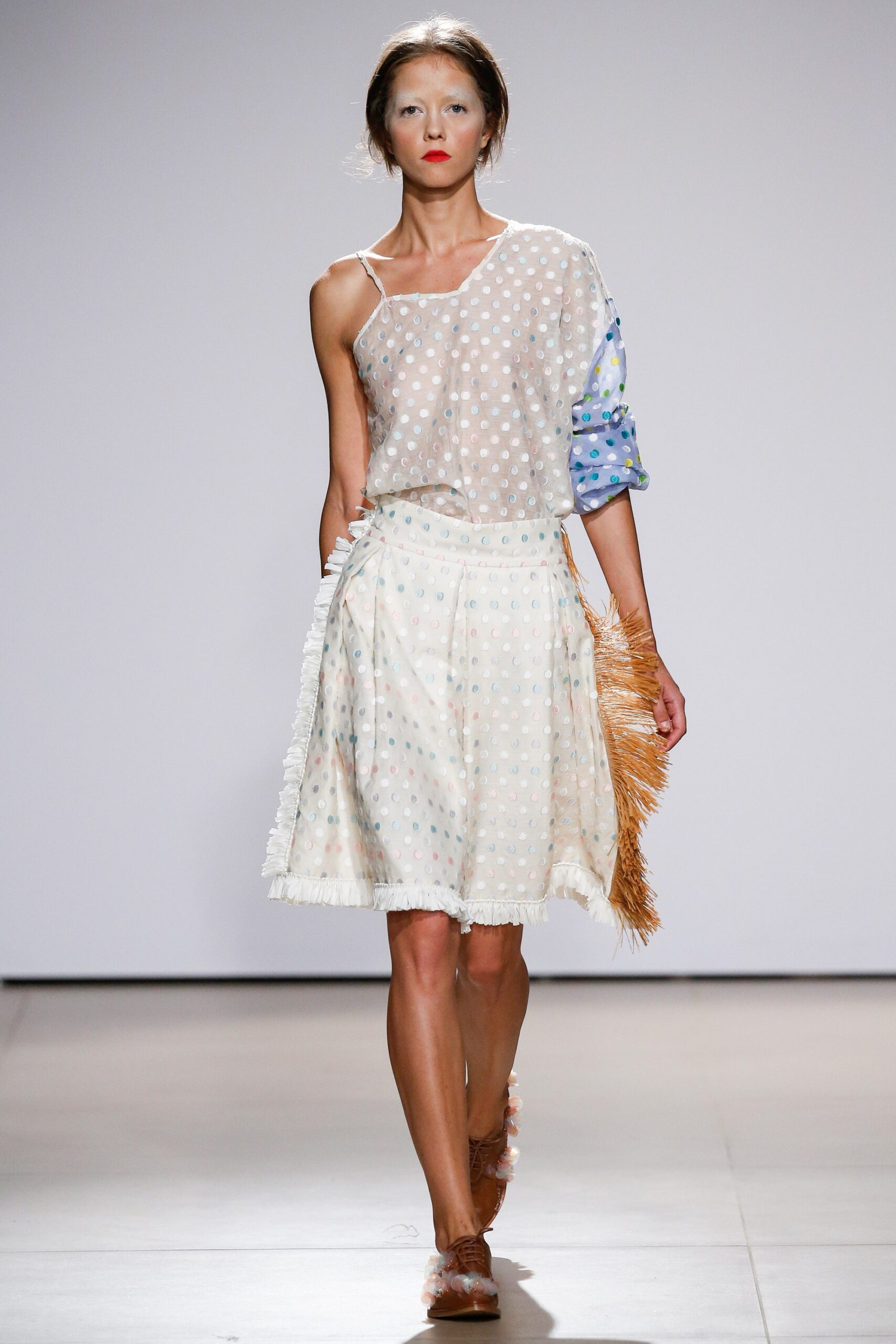 white polka-dot top and midi skirt