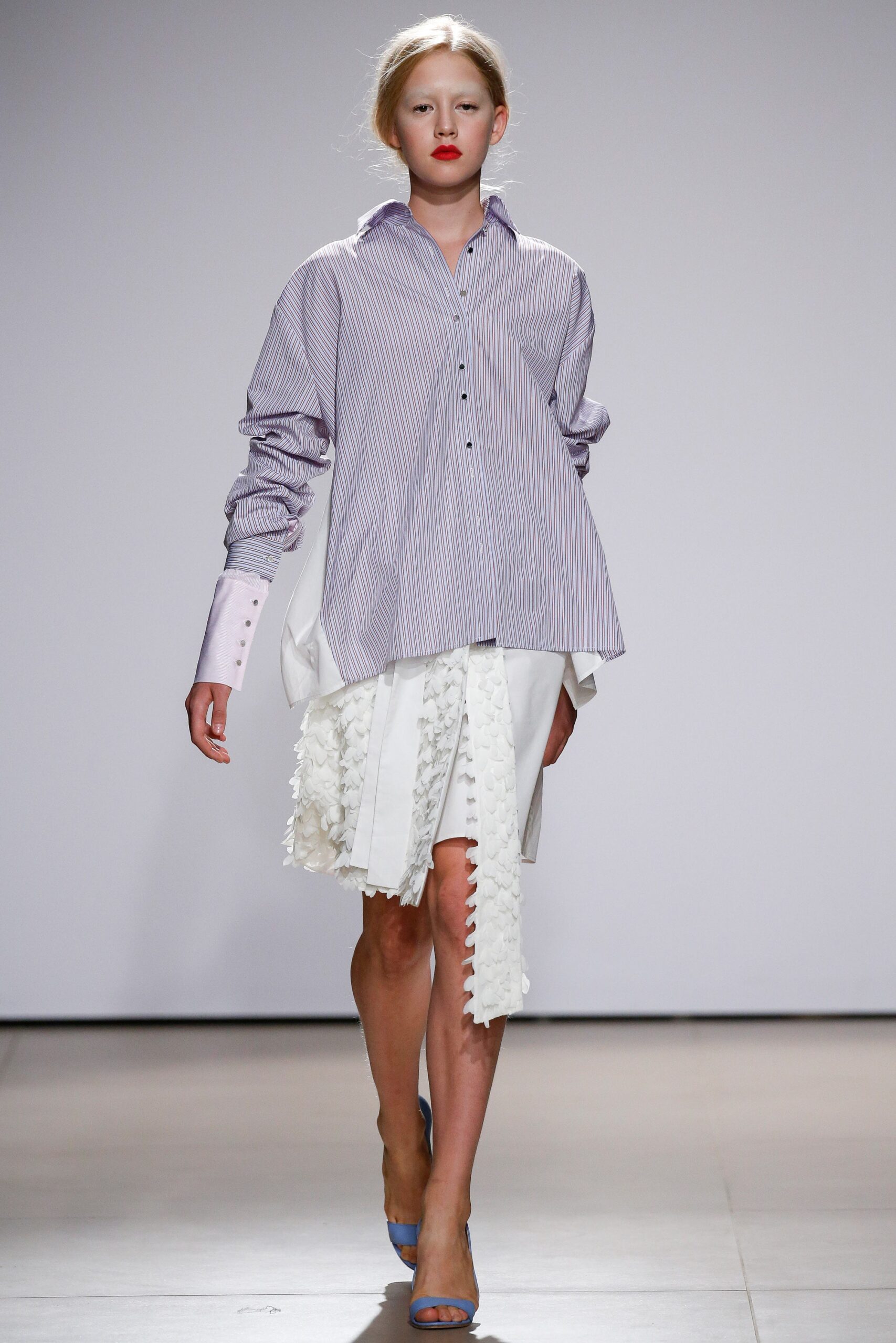 relaxed striped shirt and pleated skirt