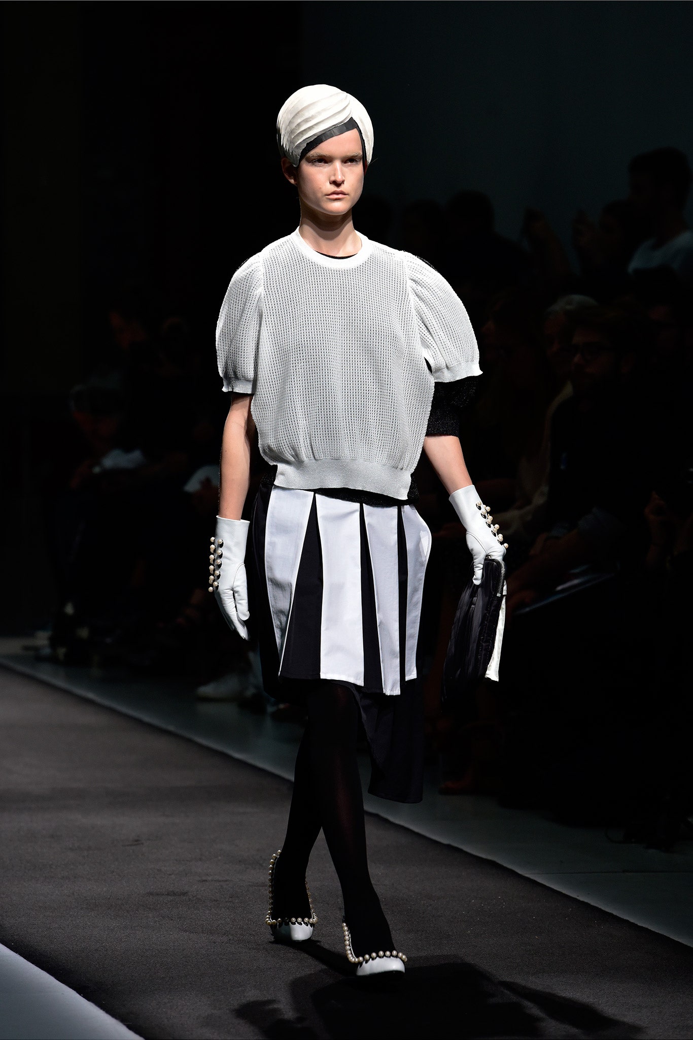 white pleated top with black skirt