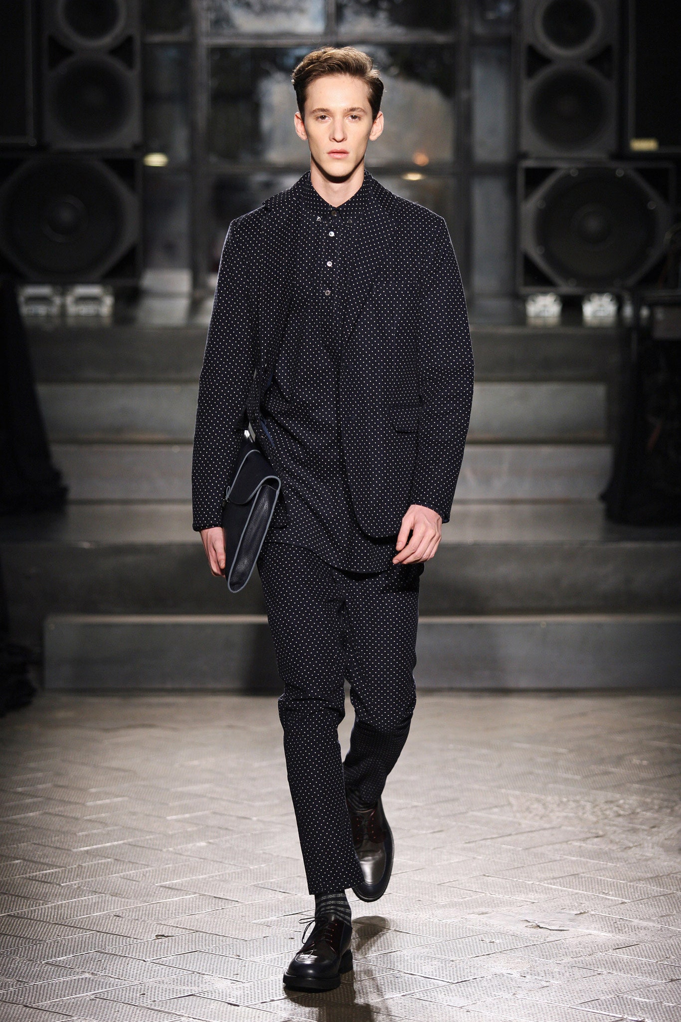 black tailored suit with clutch