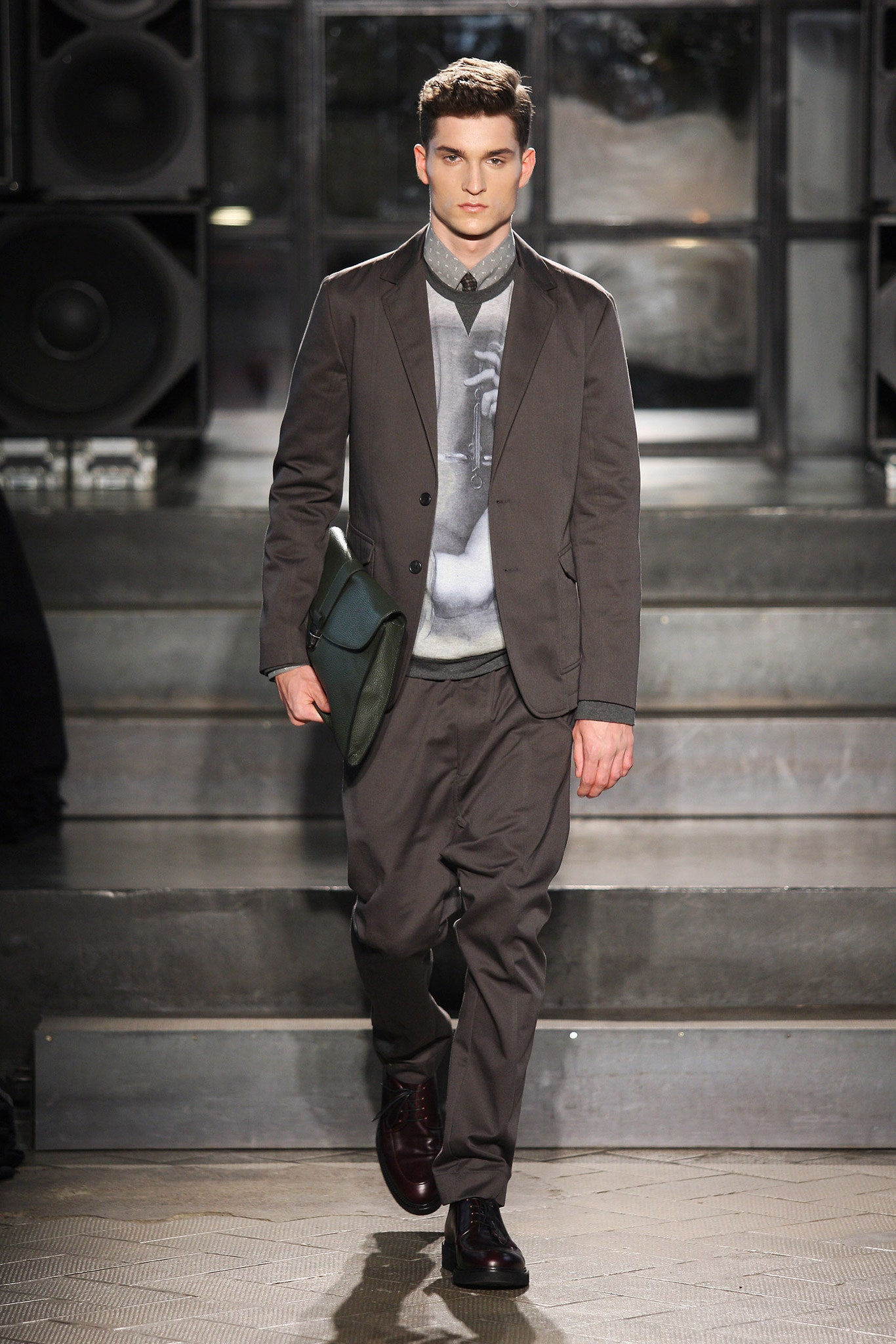 gray tailored suit with green bag