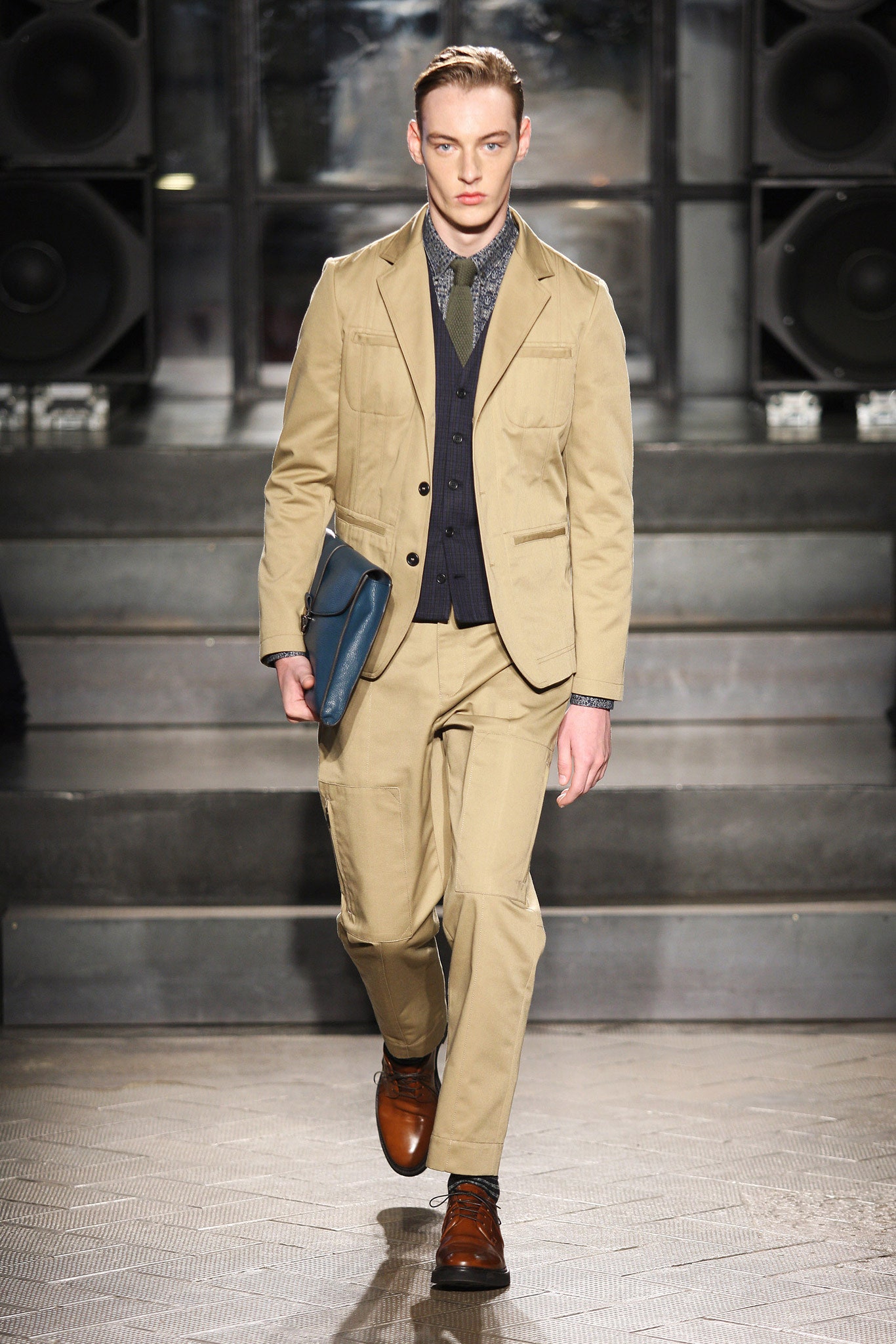 beige tailored suit with blue shirt