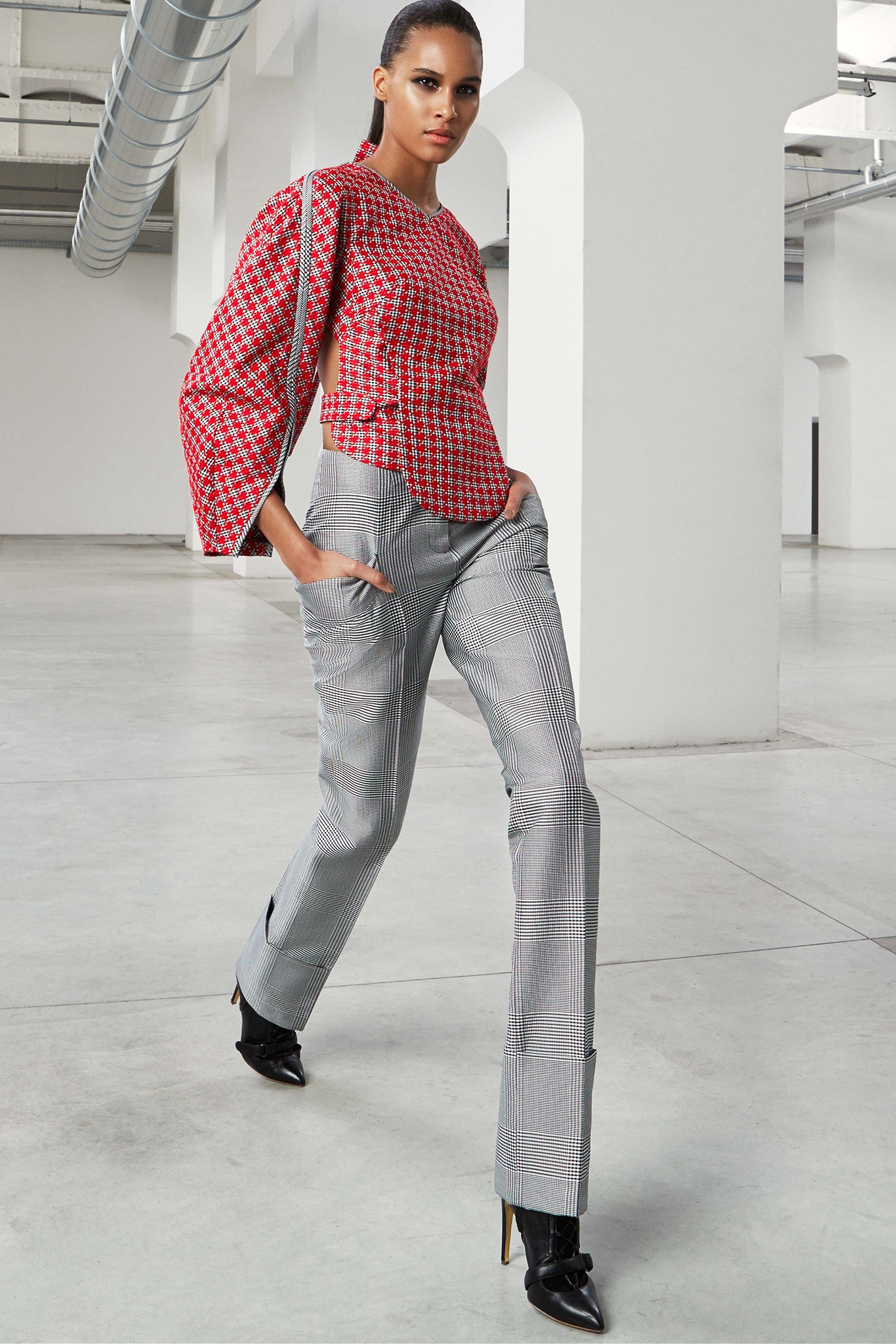 red printed fitted top with gray pants