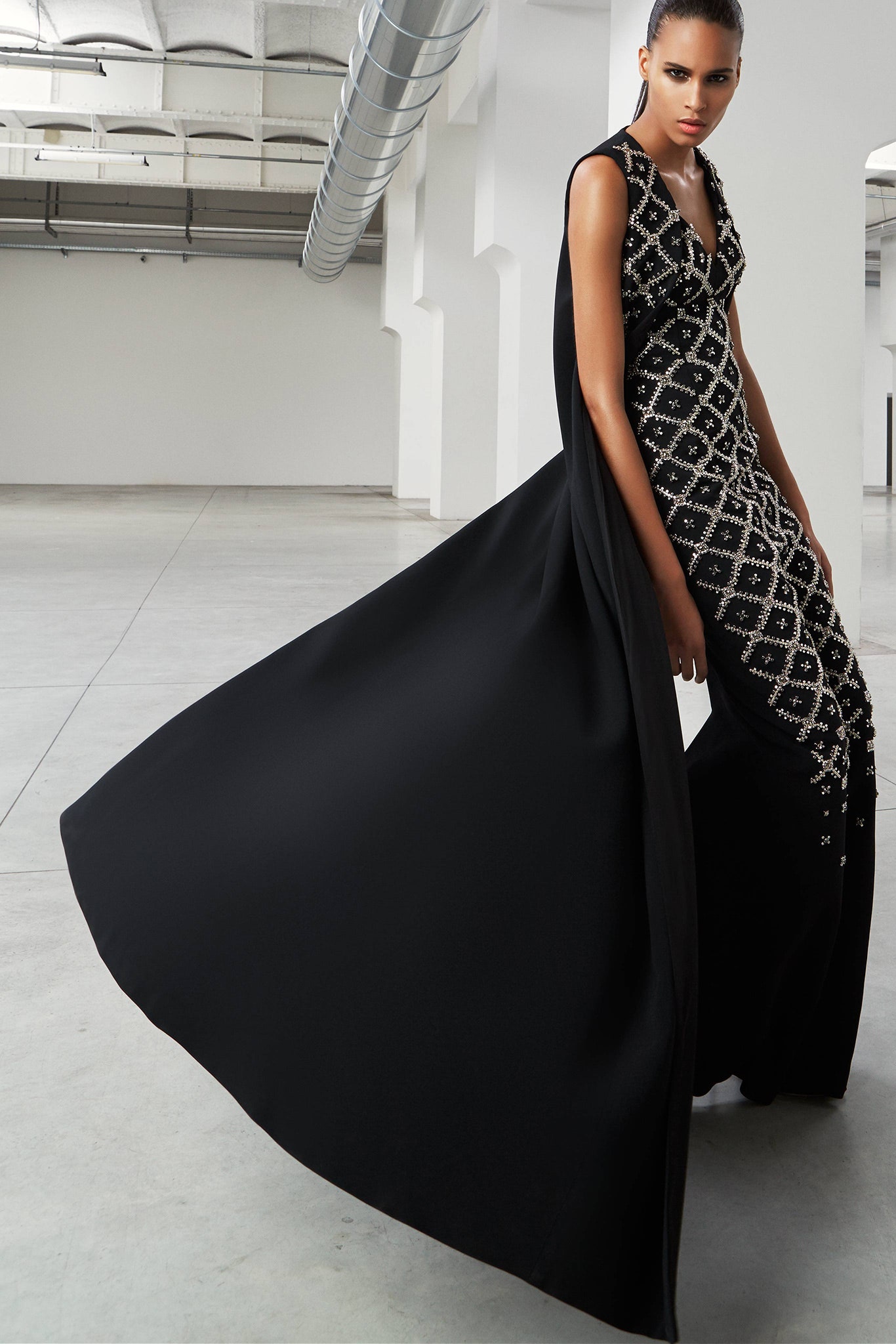 black embroidered gown with cape