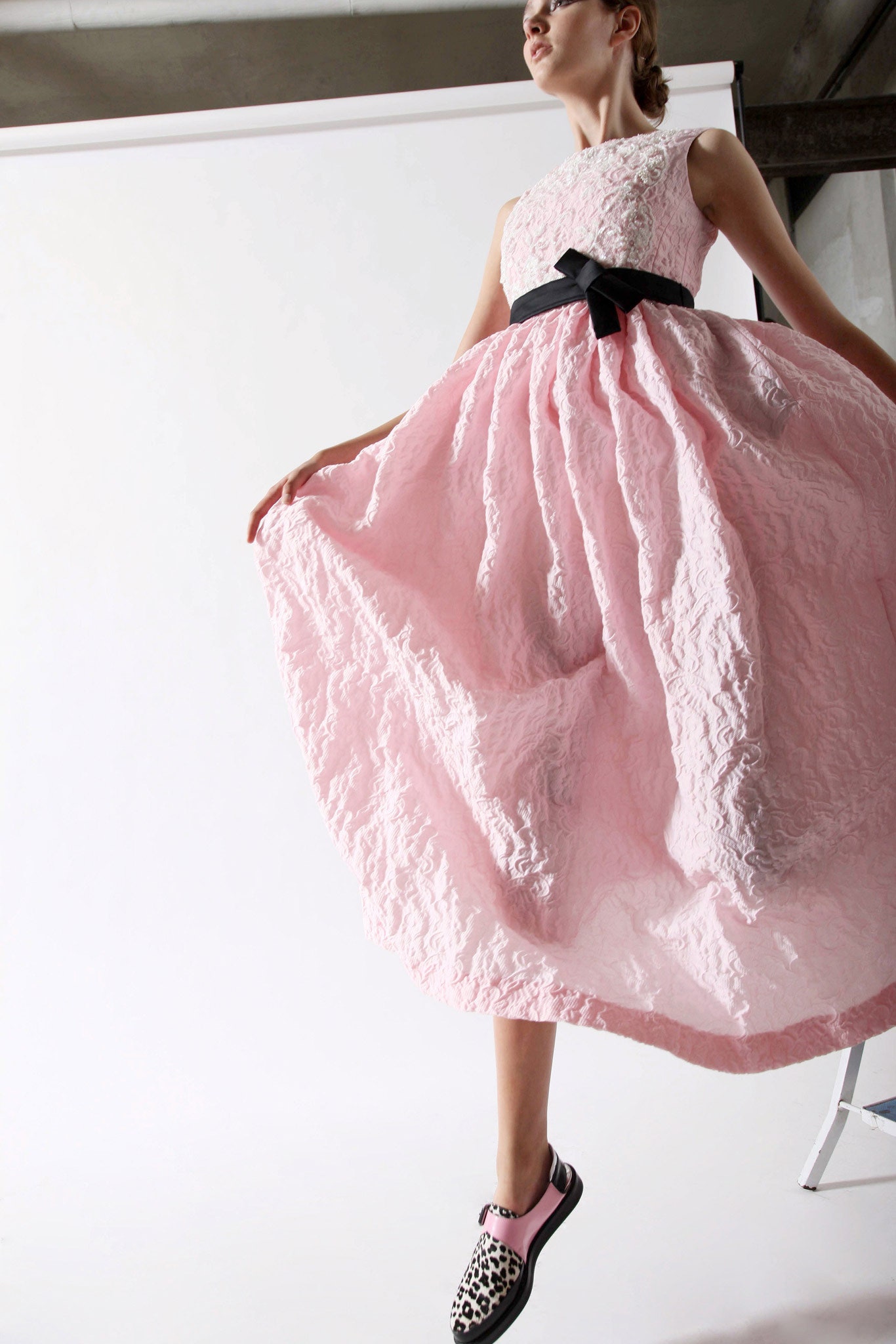 pink pleated maxi dress with animal-print shoes