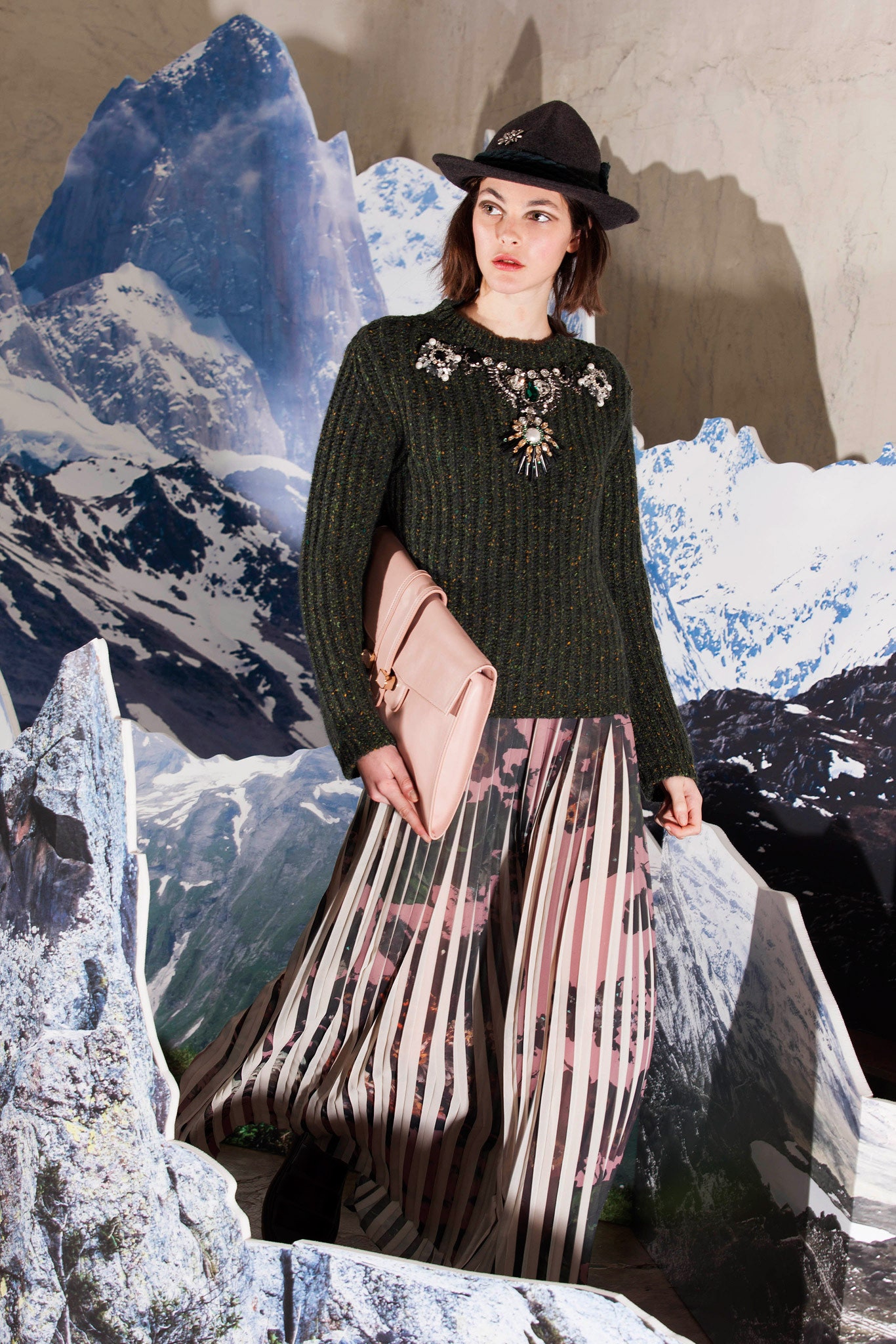 green wool sweater with pleated skirt
