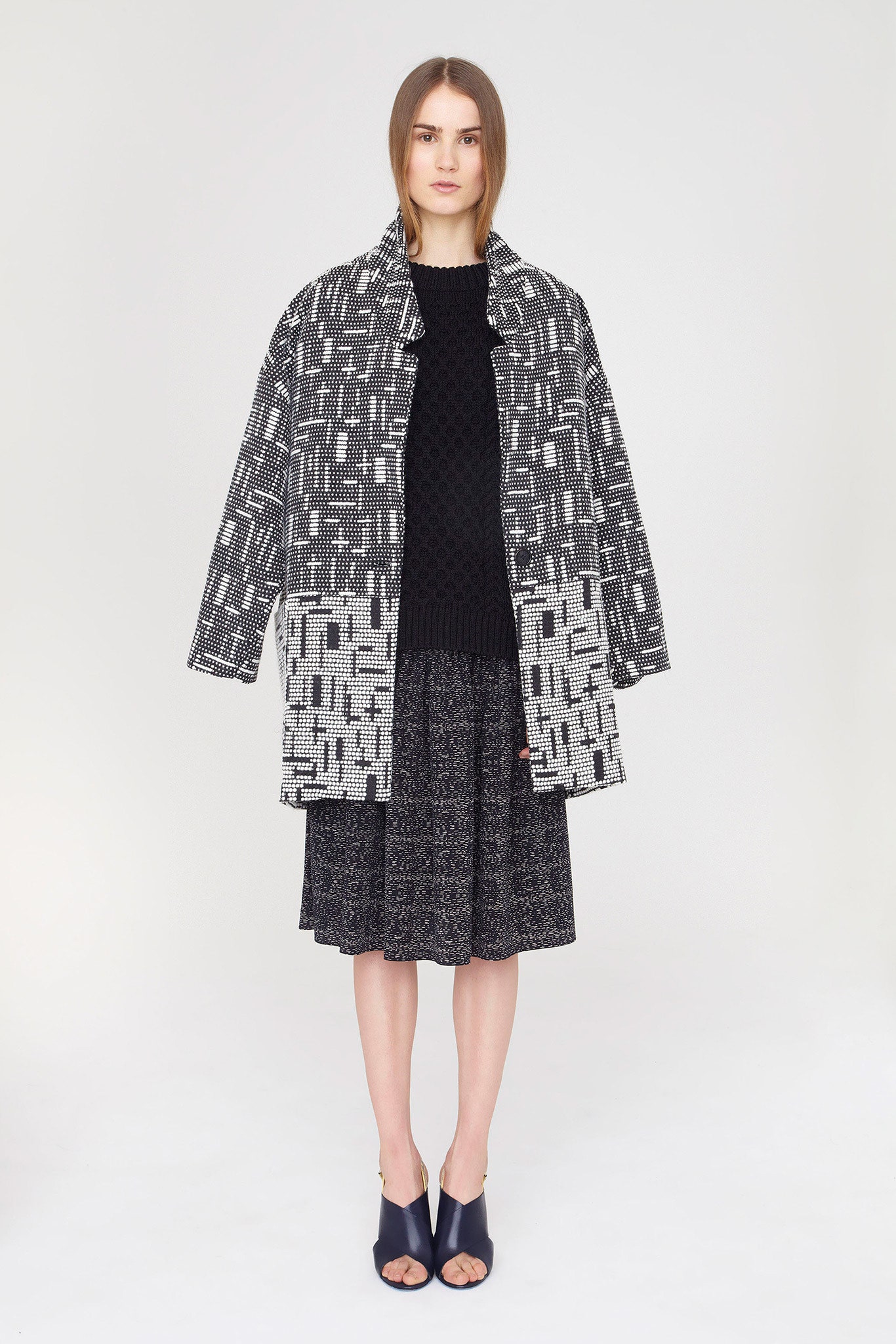 black cotton long-sleeve collared relaxed printed coat