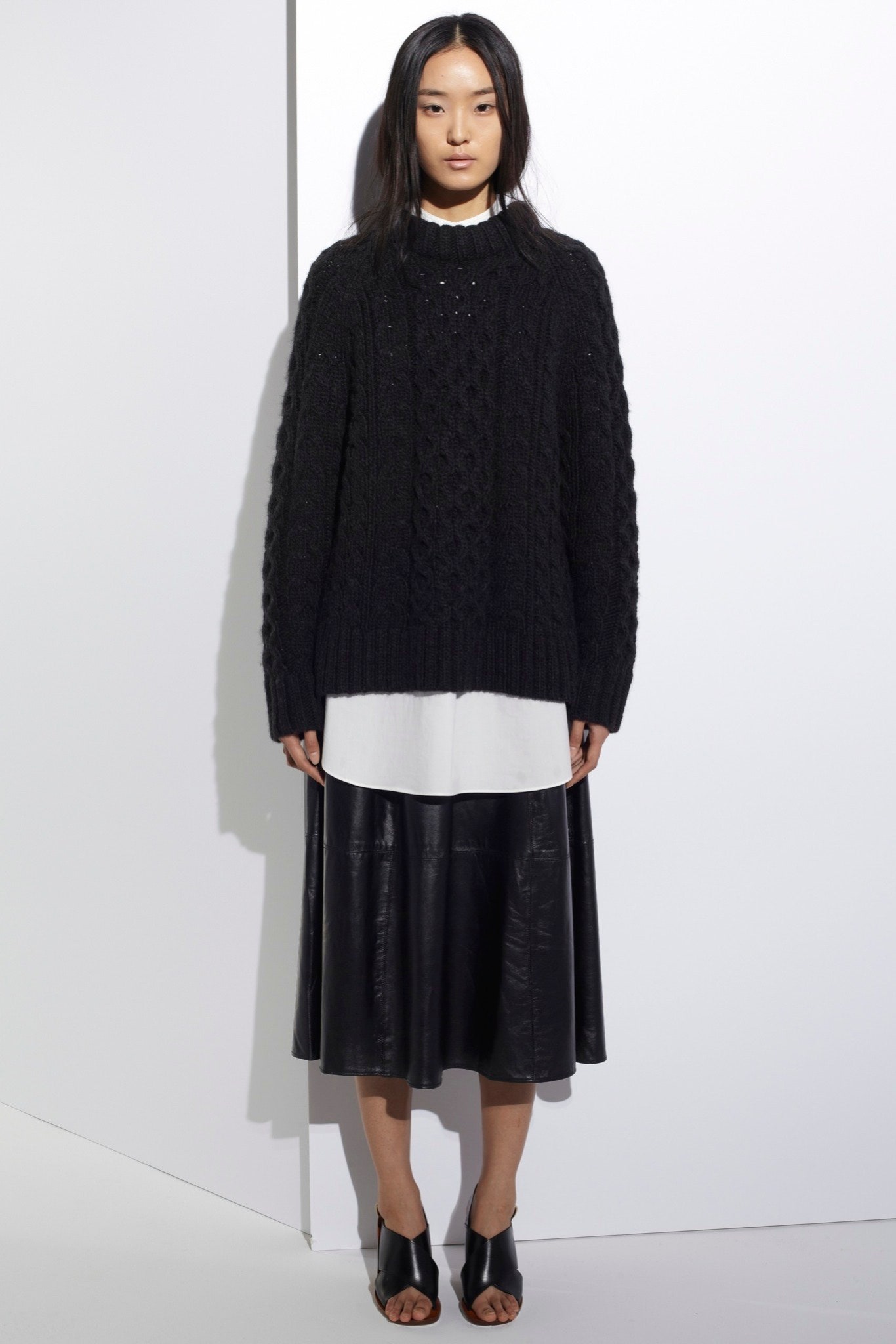 black wool sweater and leather skirt