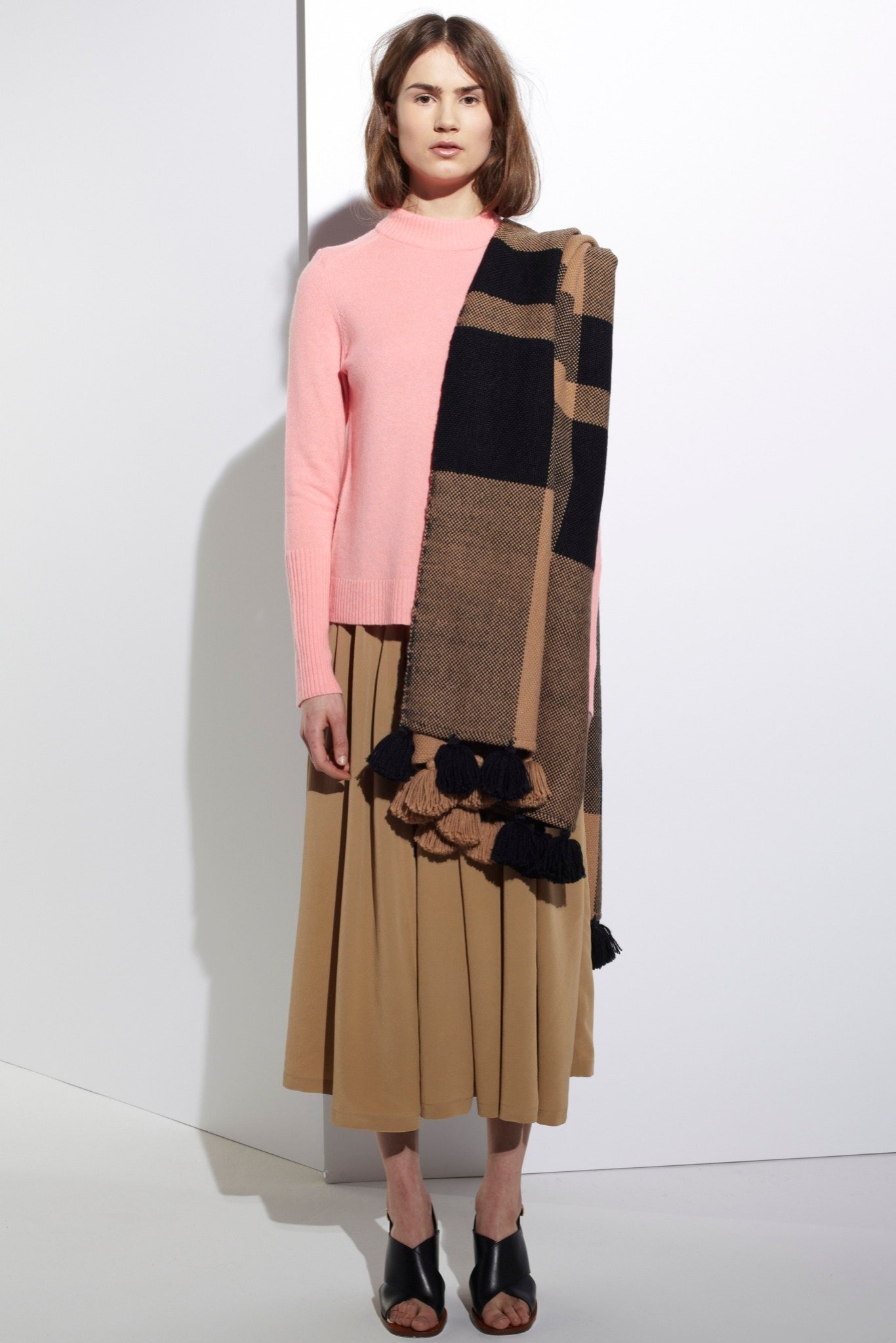pink fitted sweater beige pleated skirt