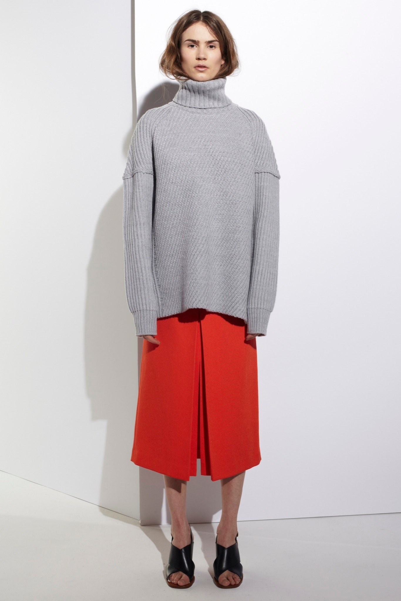 gray oversized sweater and red skirt