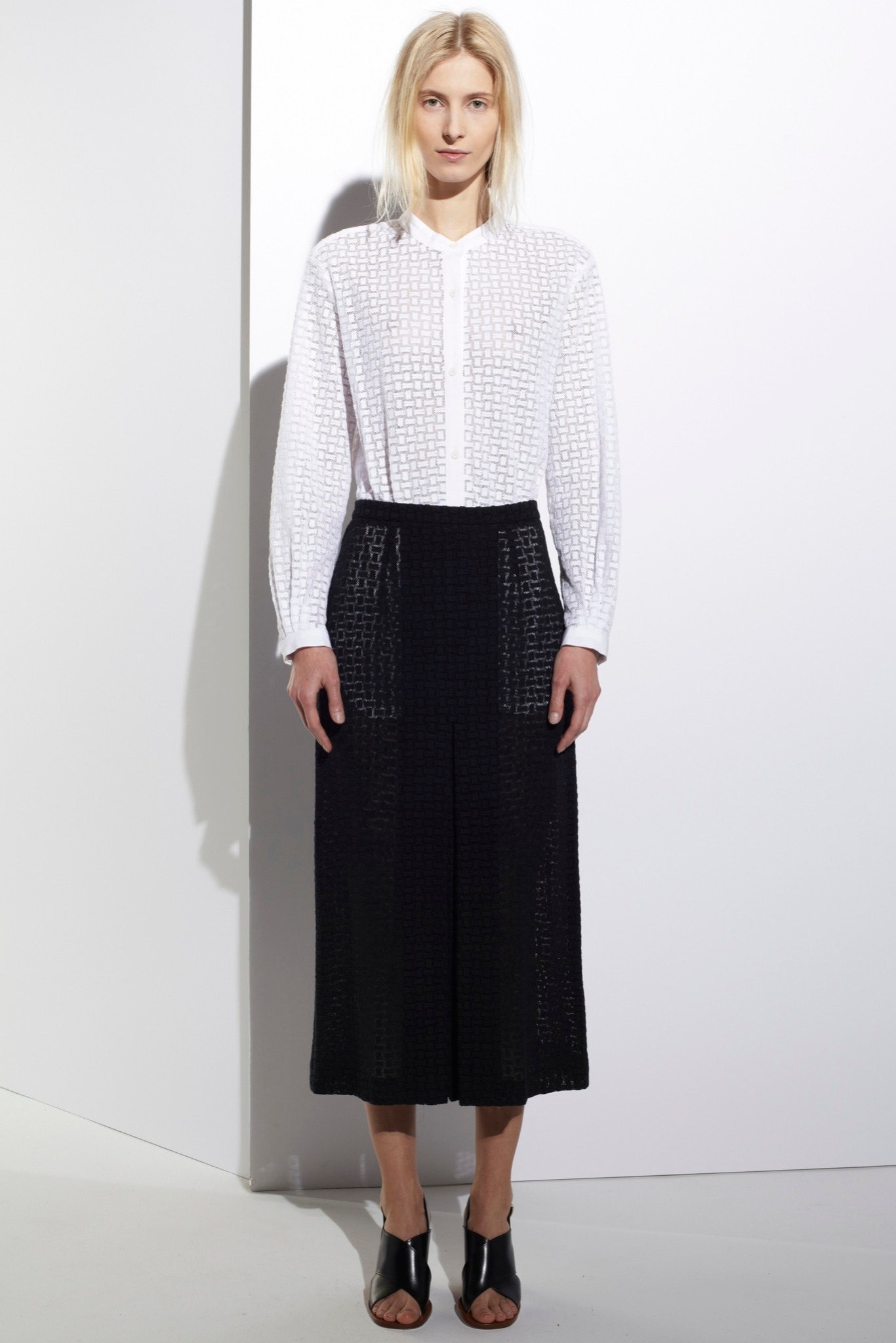 white shirt and black pleated skirt