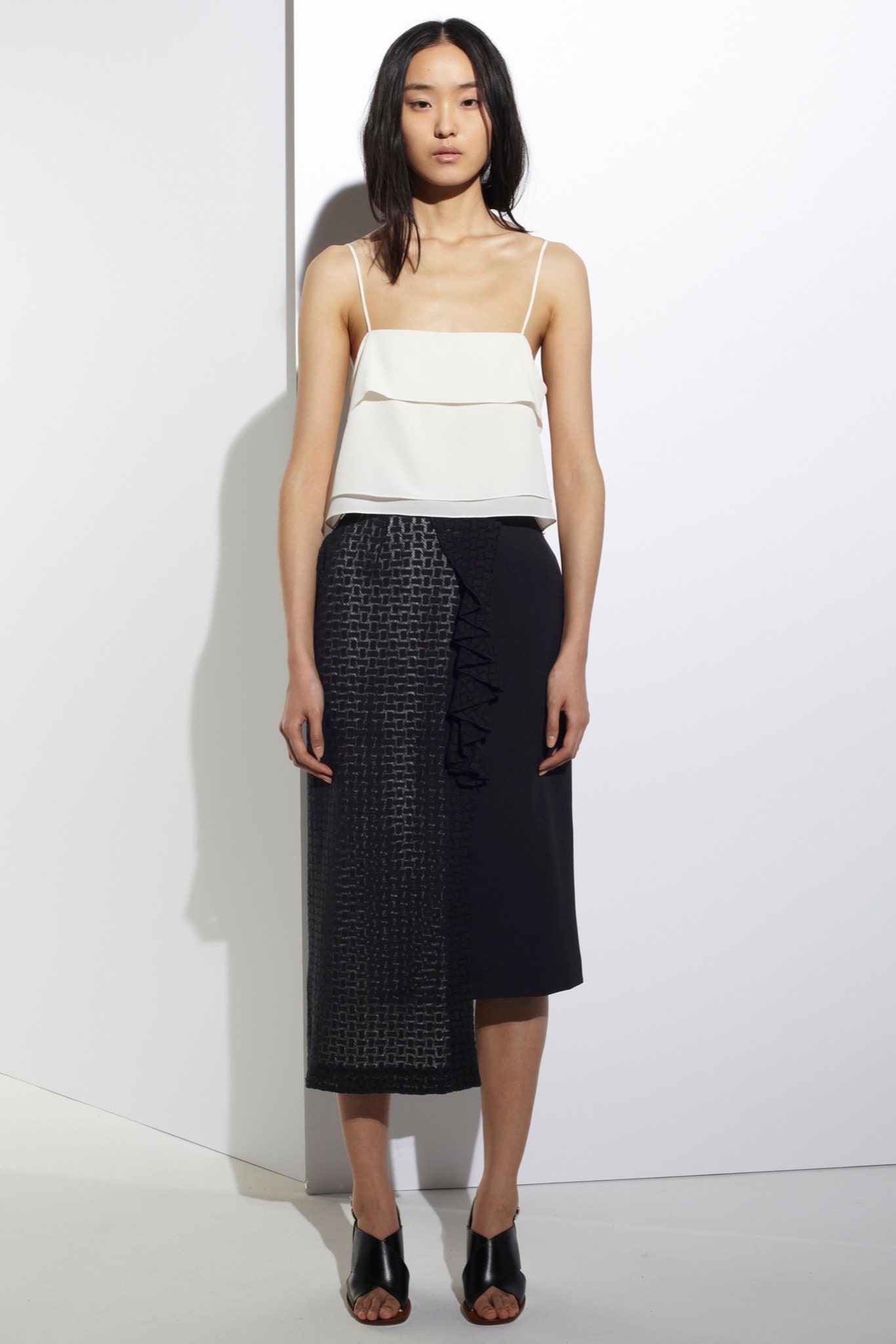 white silk layered top and black asymmetric skirt
