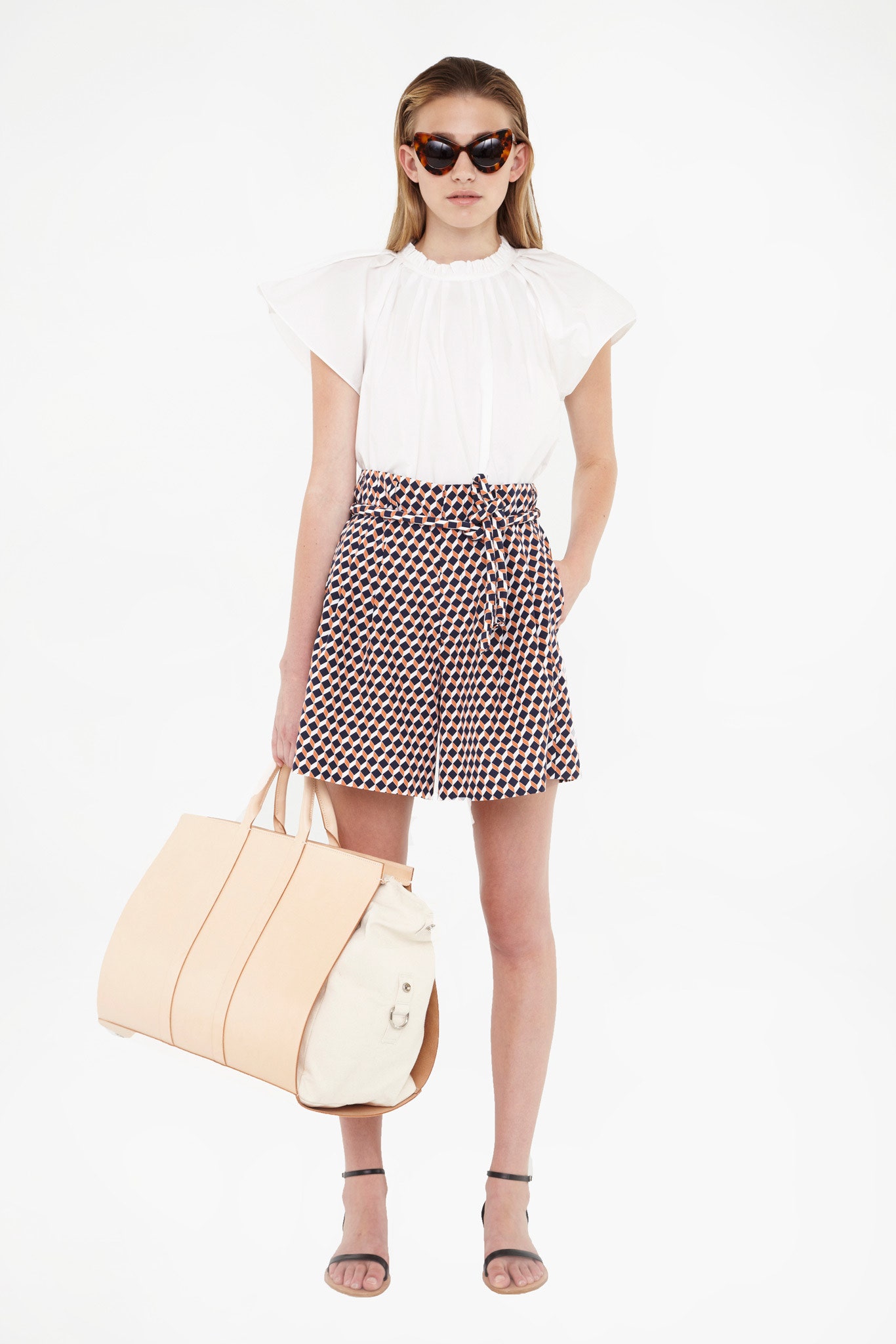 white pleated top with printed shorts