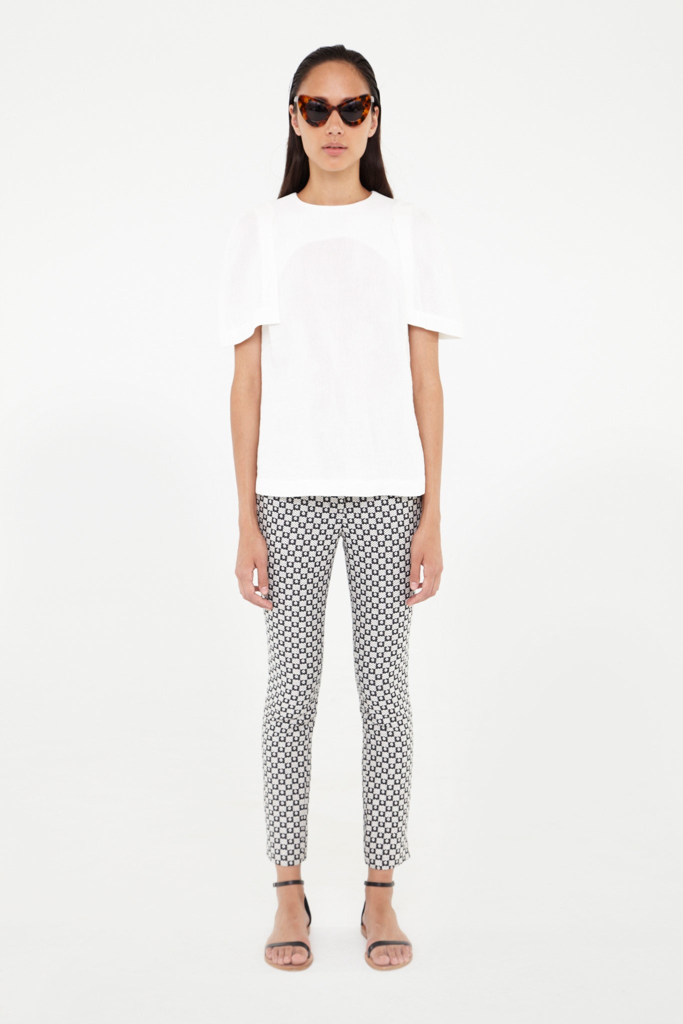 white fitted top with printed pants