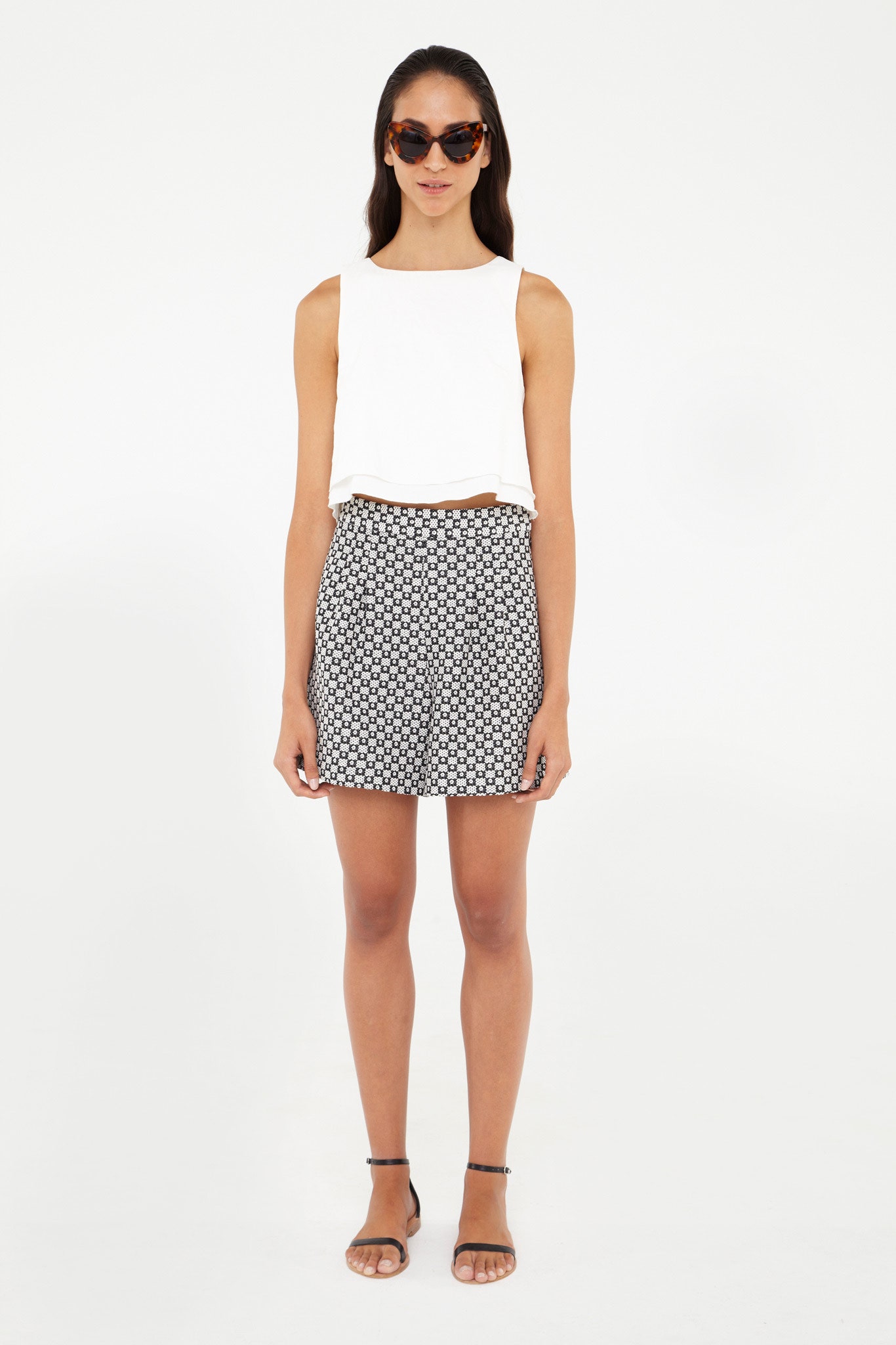 white cropped top and pleated skirt