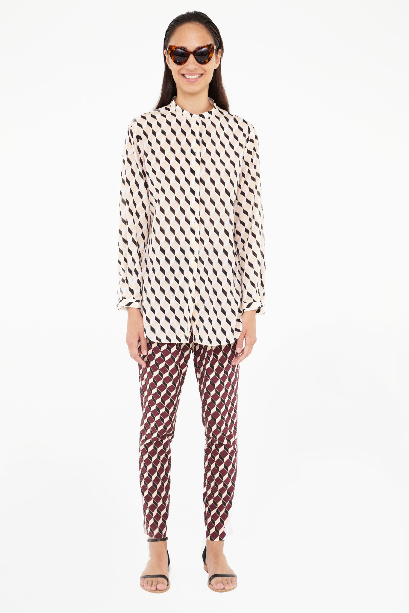 beige printed shirt with red pants