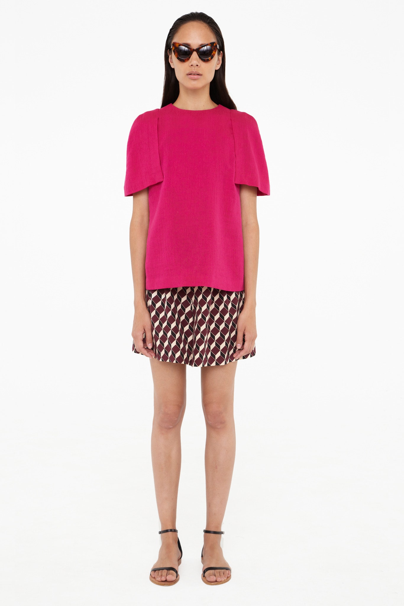 pink fitted top with printed shorts