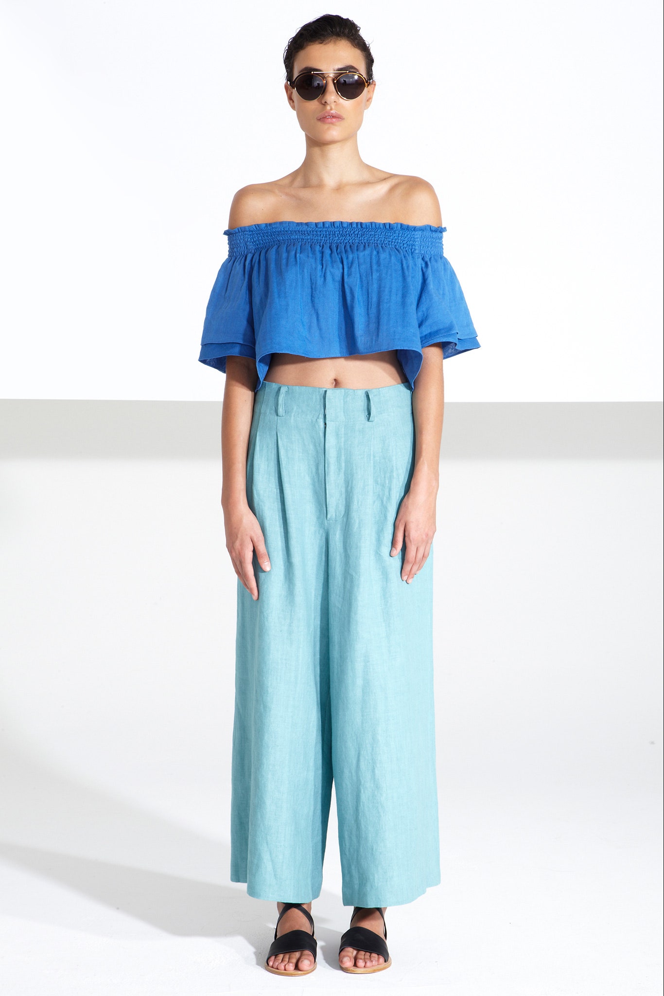 blue cotton sleeveless off-shoulder fitted cropped top