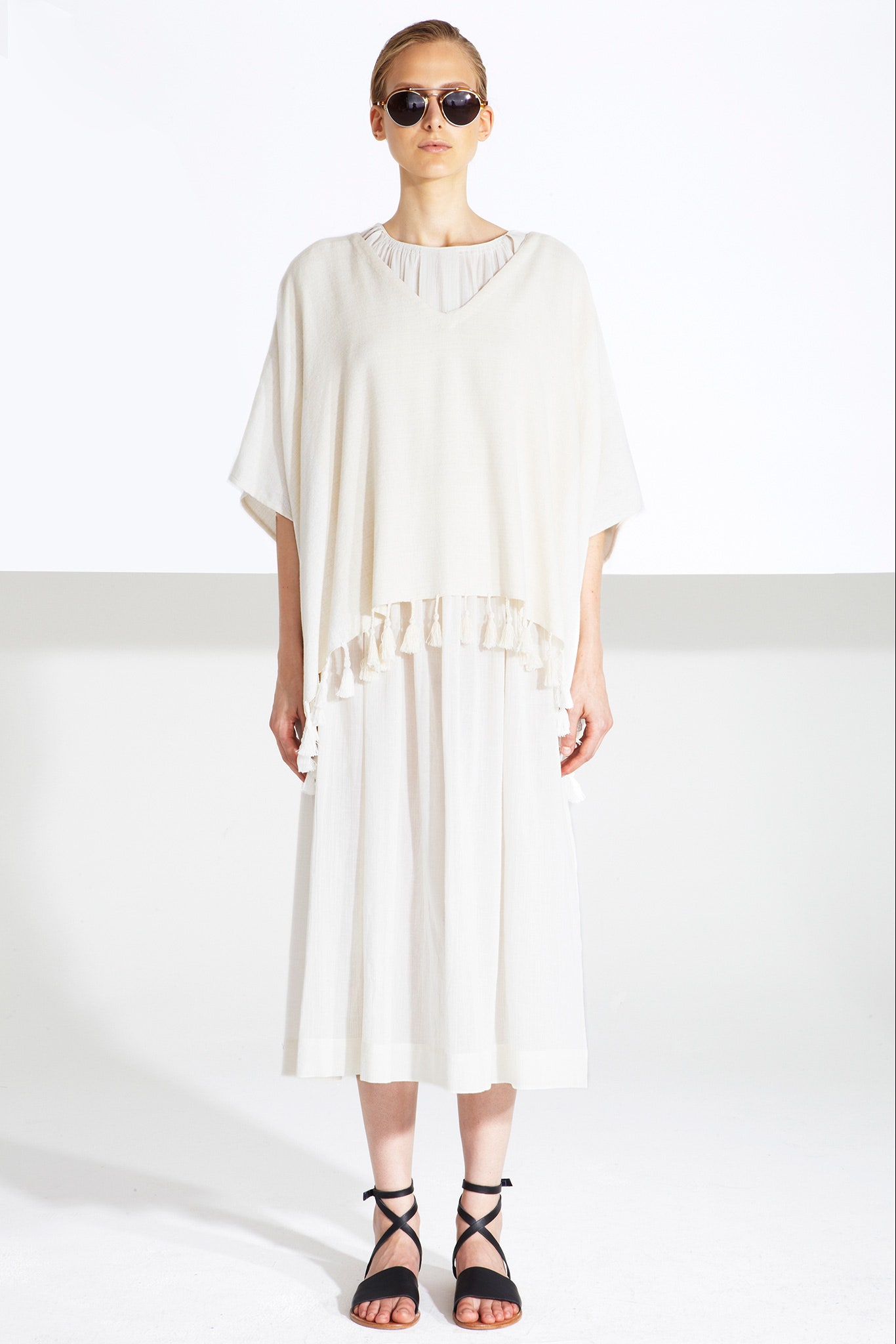 white cotton poncho and dress