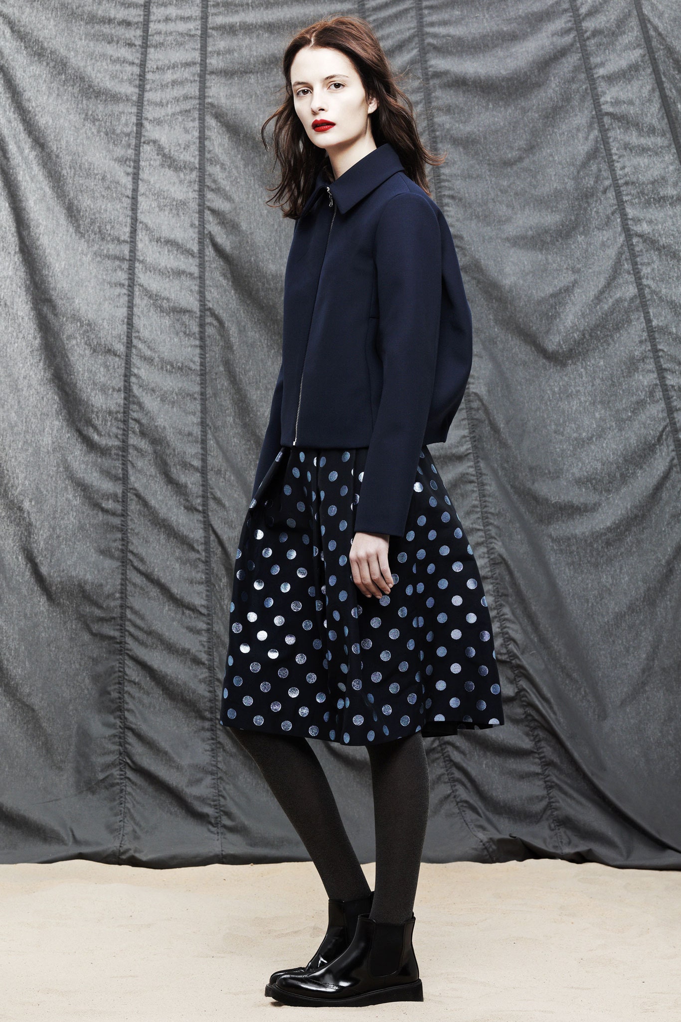 navy jacket and polka-dot skirt