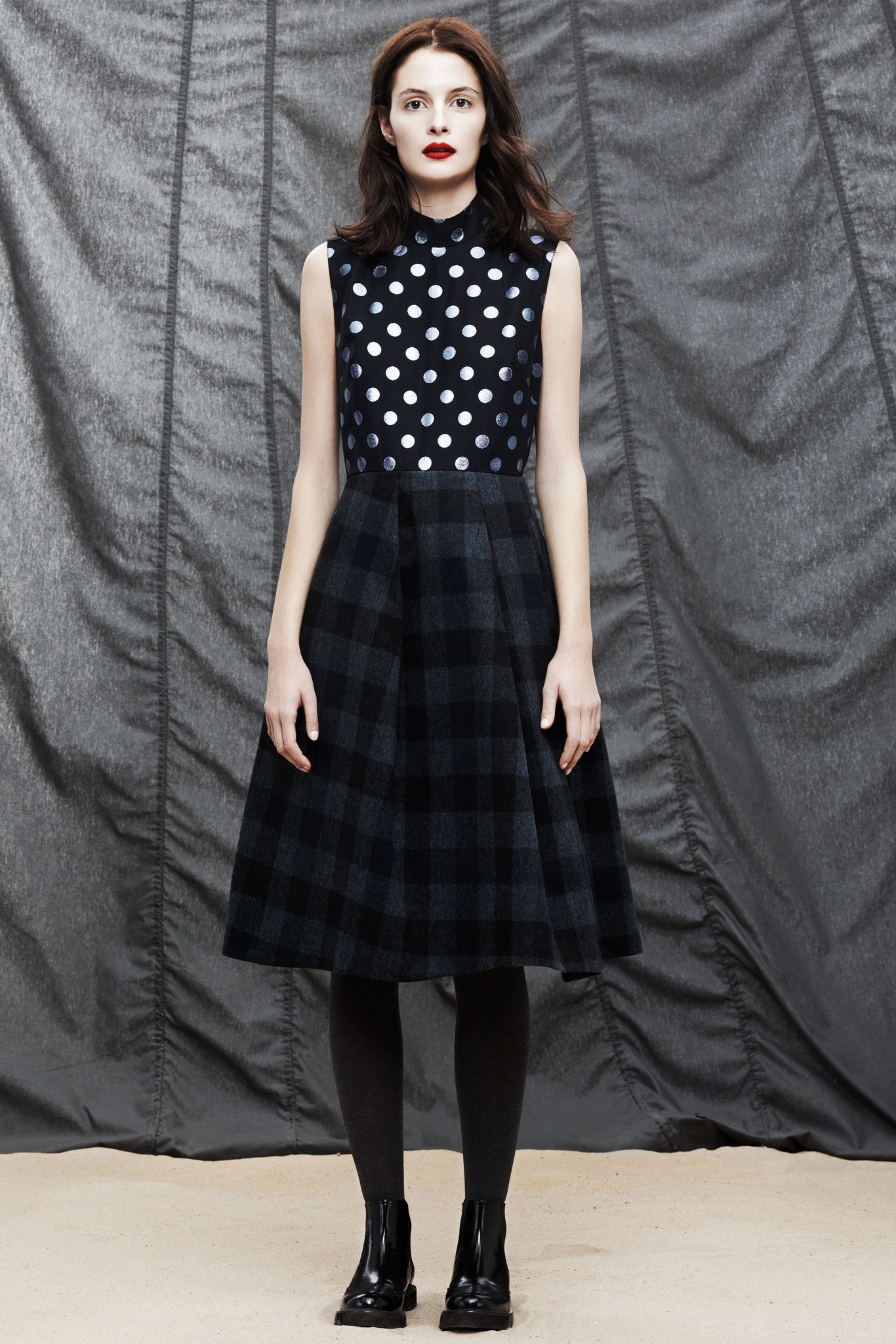 black and white polka-dot top with pleated skirt