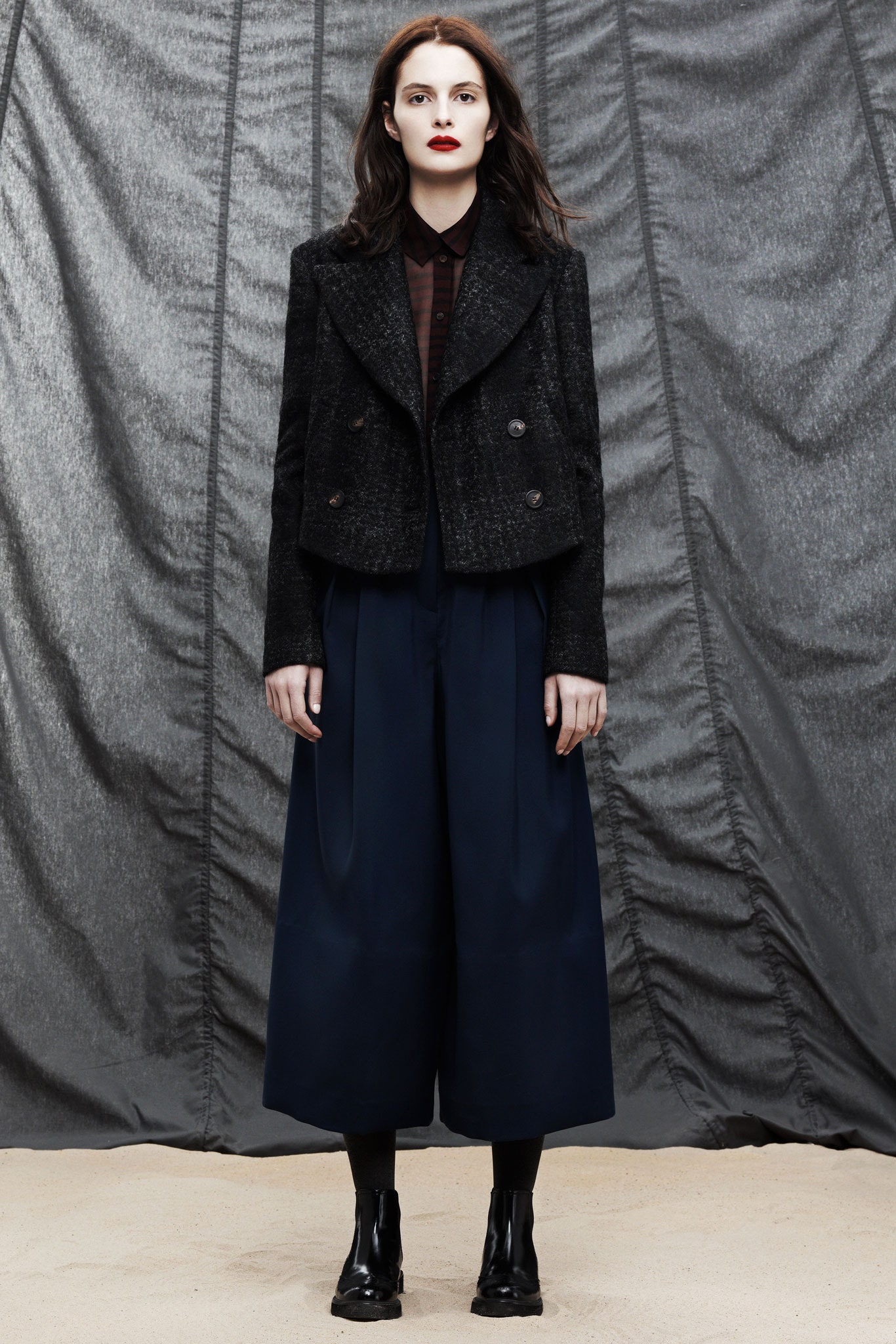 black tailored jacket blue wide-leg pants