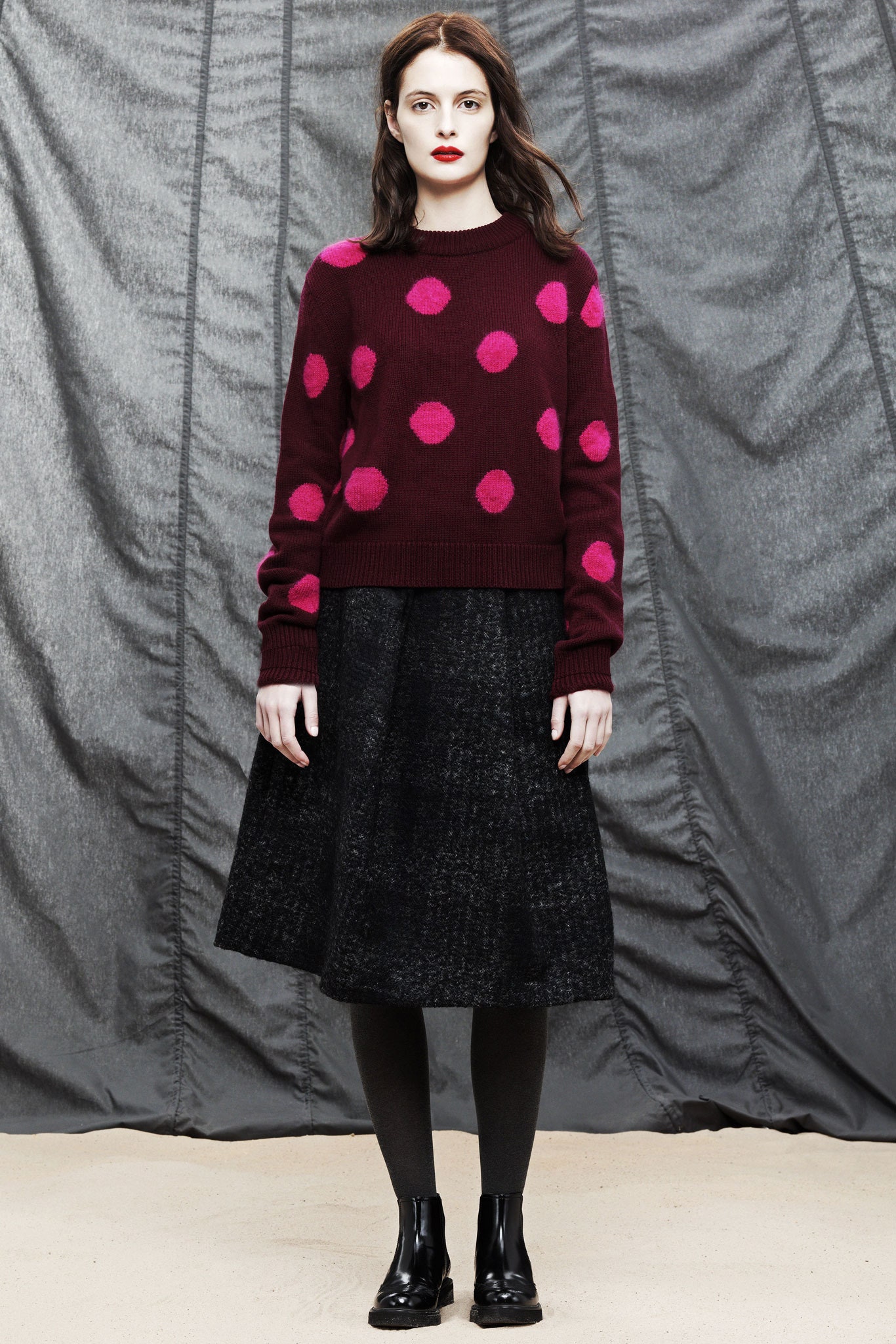 burgundy polka-dot sweater and black midi skirt