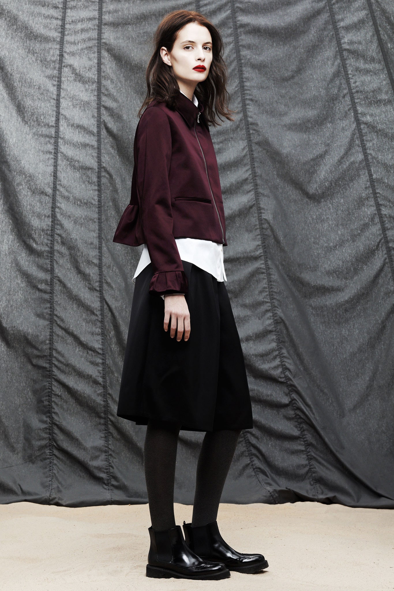 maroon fitted jacket with black skirt