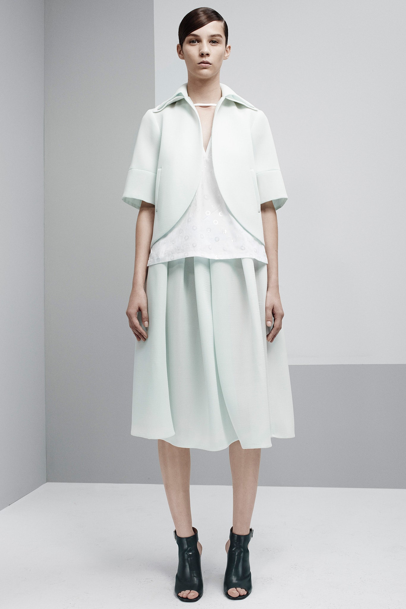 mint jacket white top pleated skirt