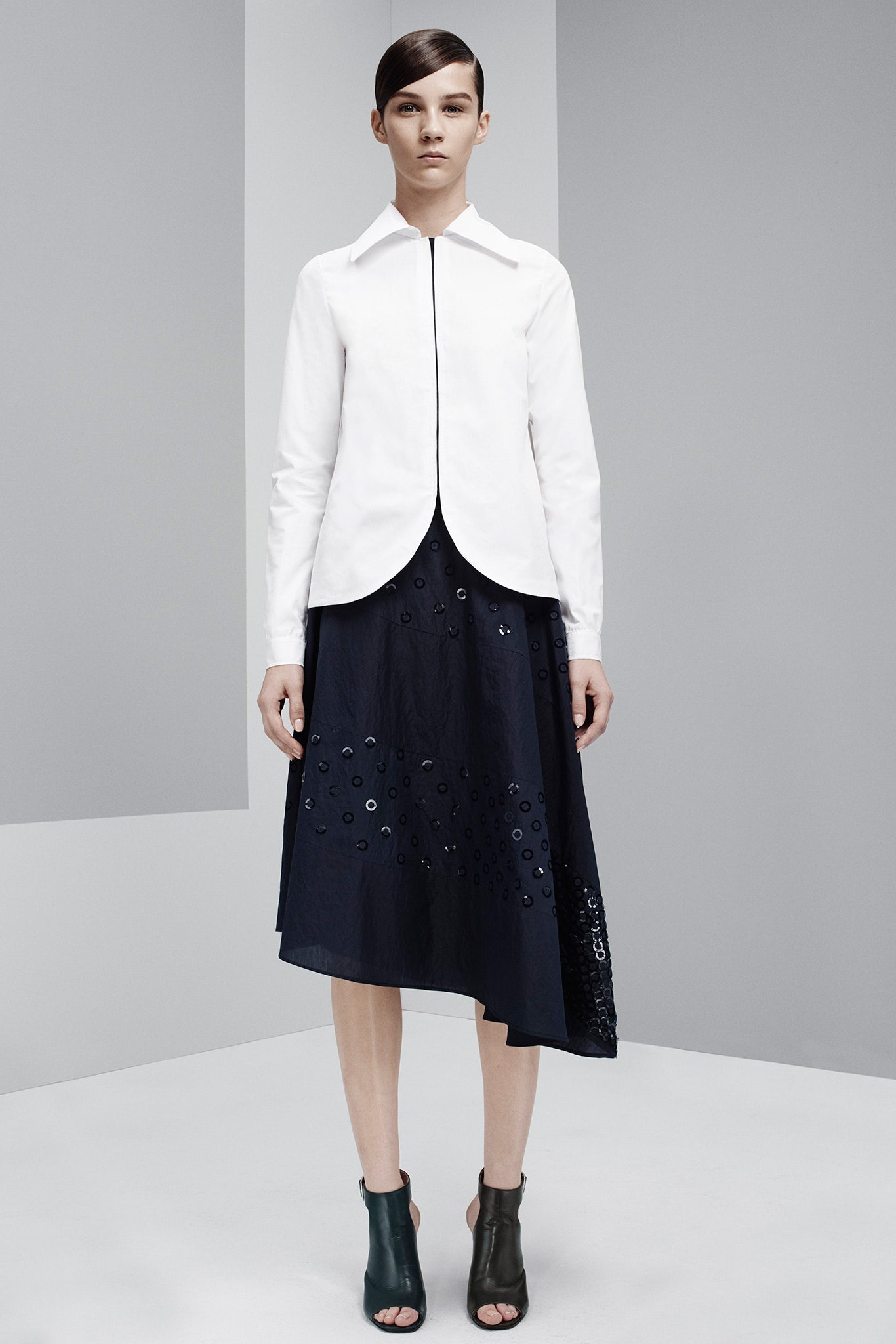 white fitted shirt with asymmetric navy skirt