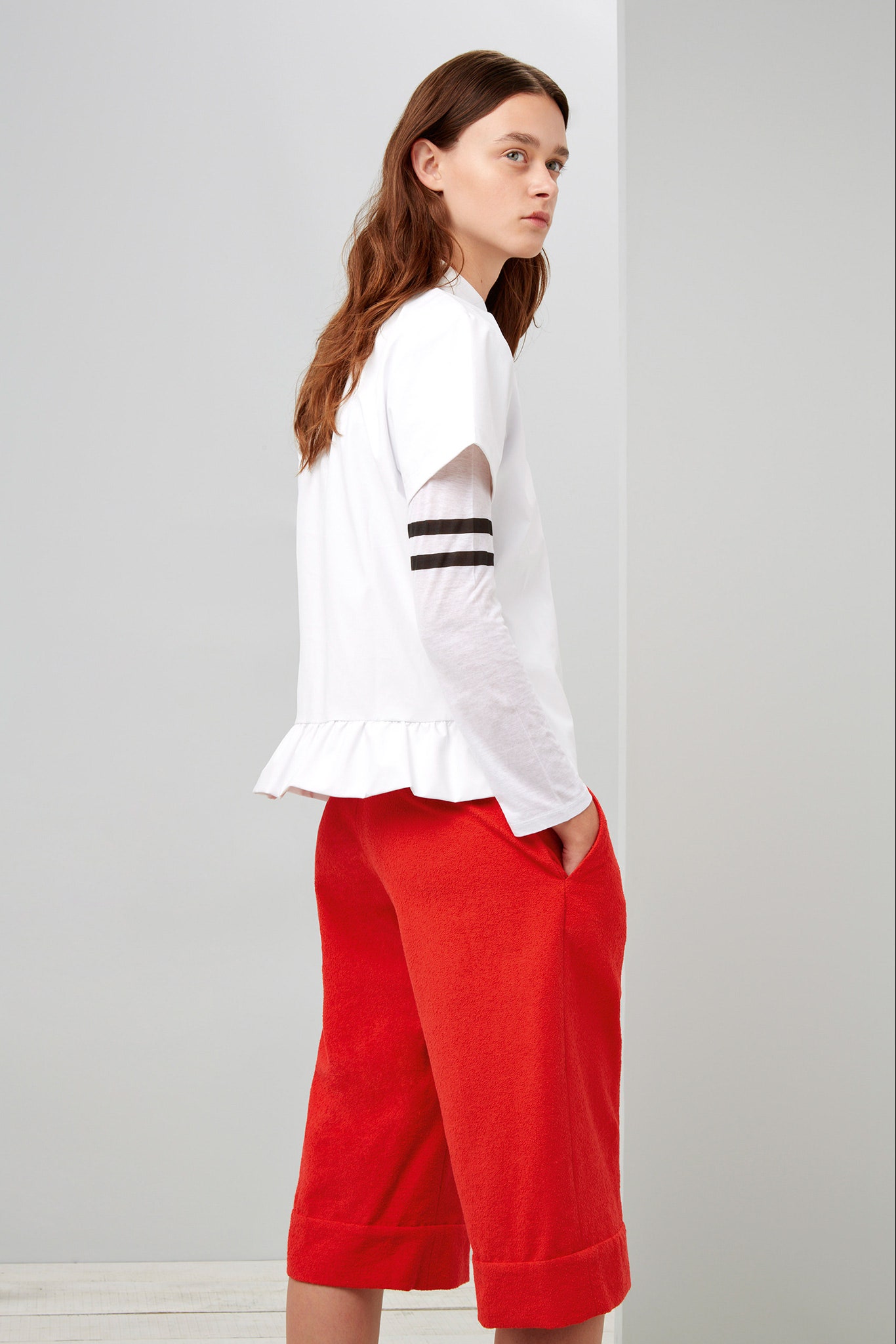 white relaxed top and red pants