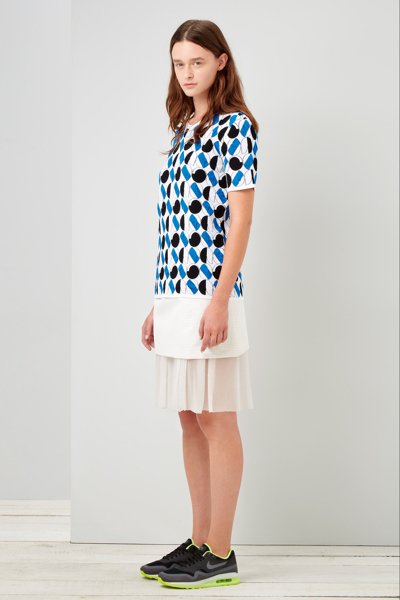 blue printed top with white skirt