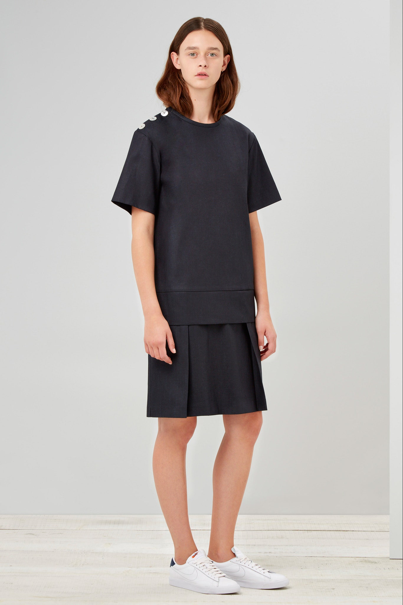 black relaxed top with pleated skirt
