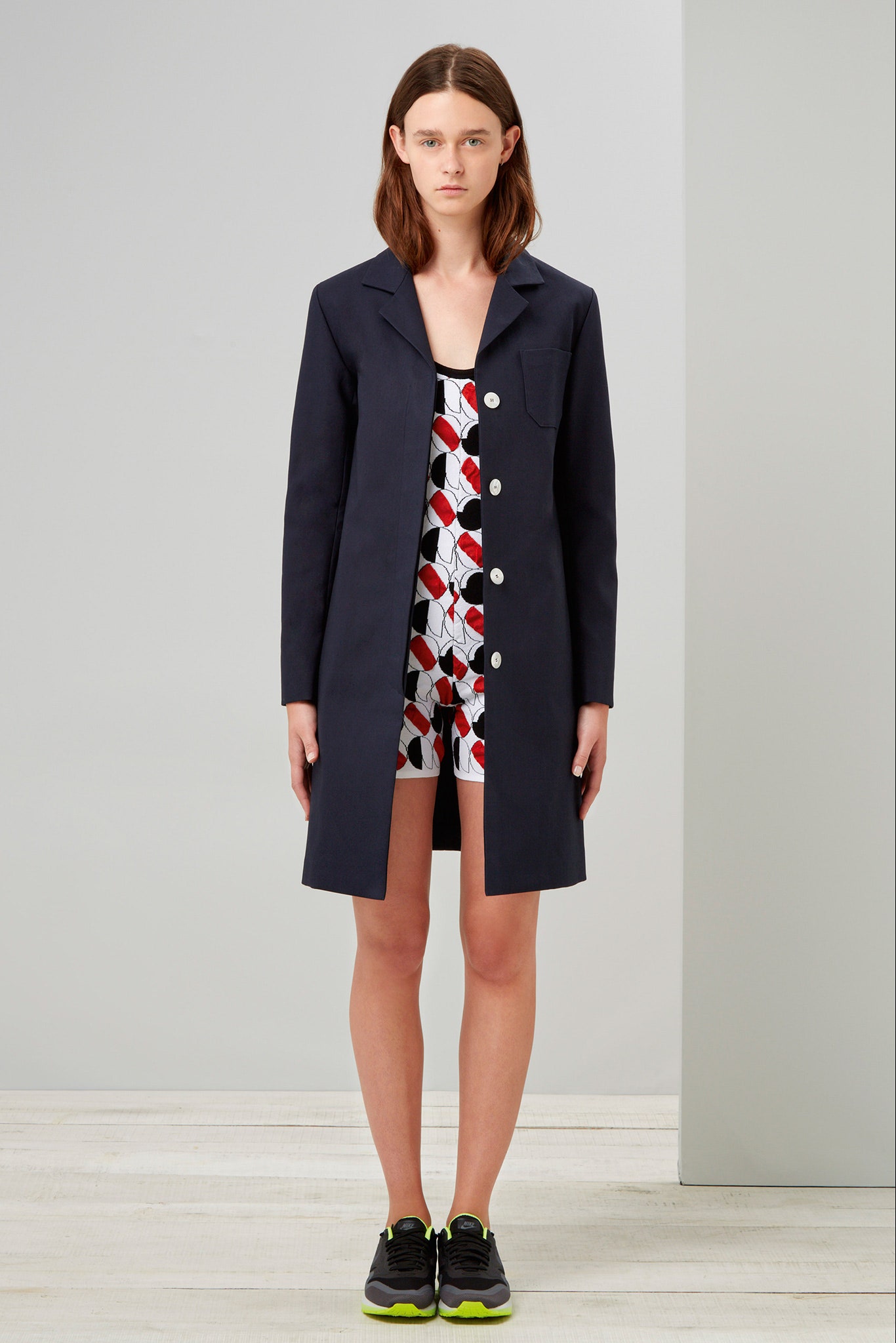 black fitted coat and printed romper