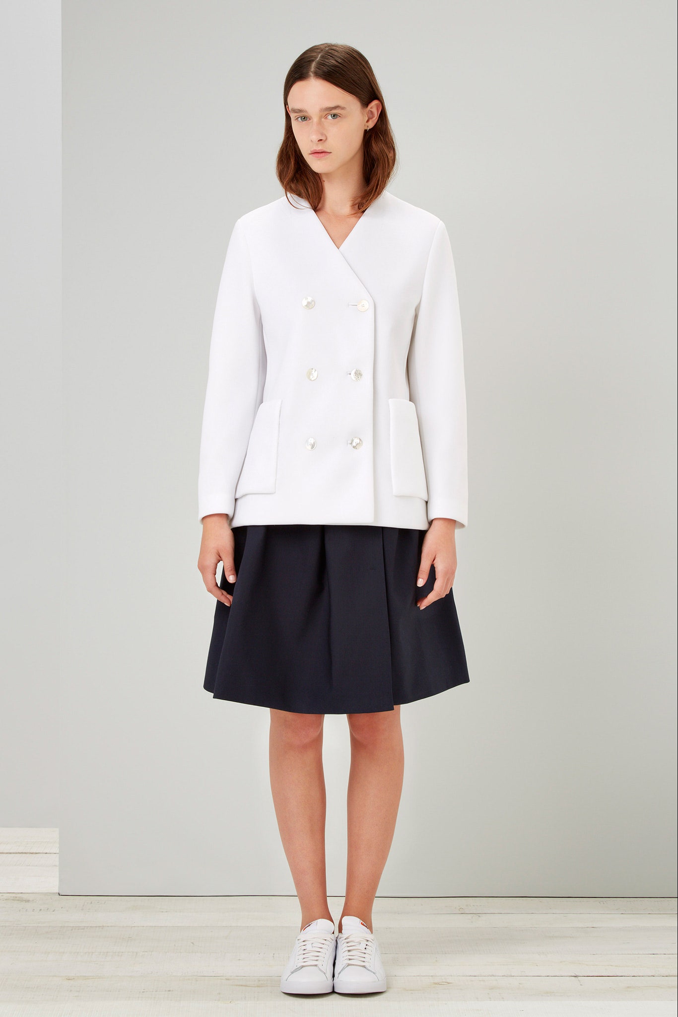white cotton long-sleeve collared structured buttoned pockets blazer
