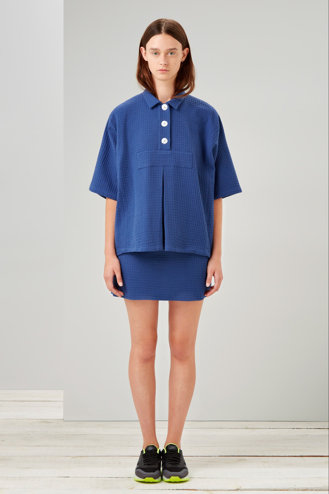 blue cotton short-sleeve collared relaxed buttoned top