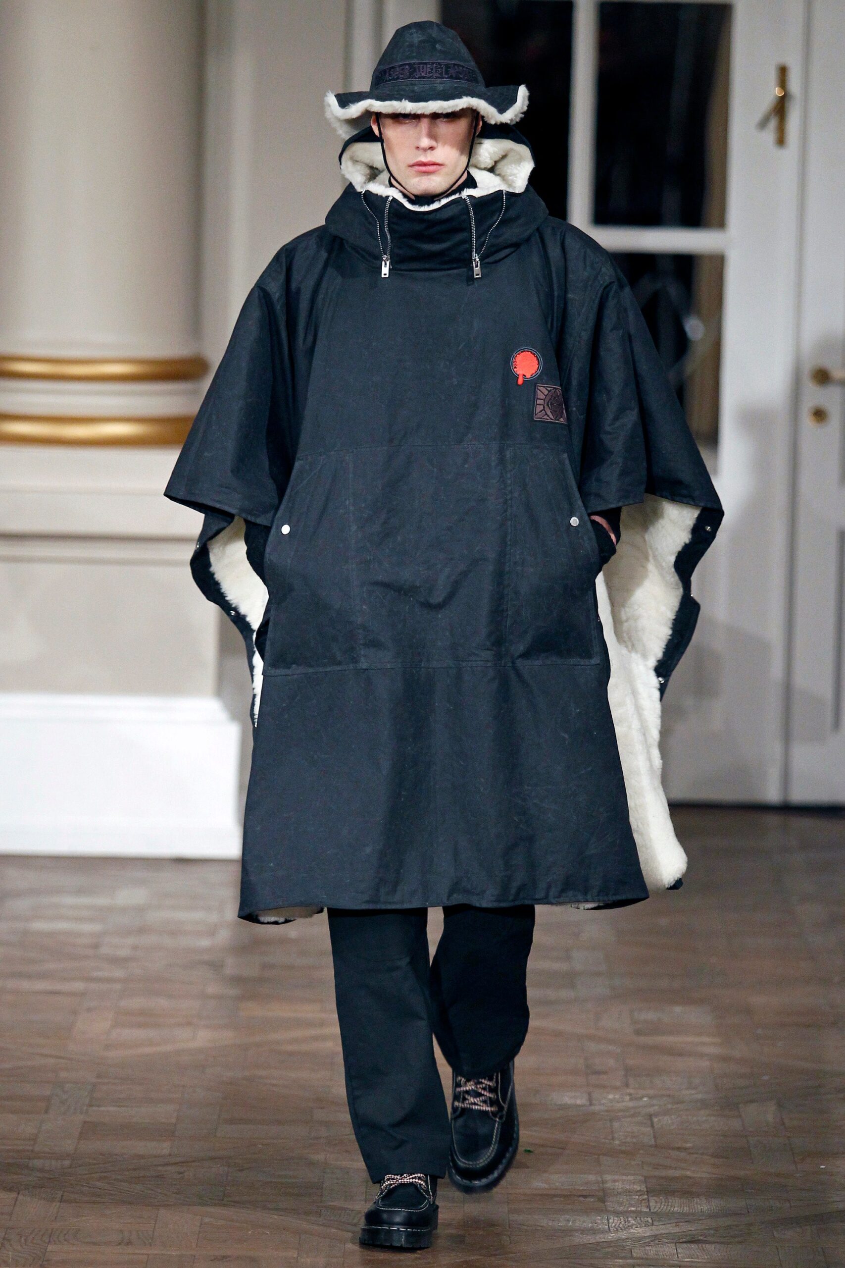 black cotton poncho with relaxed pants