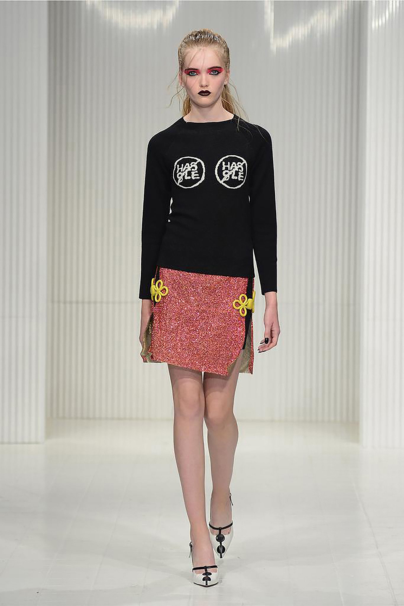 black fitted sweater and red mini skirt