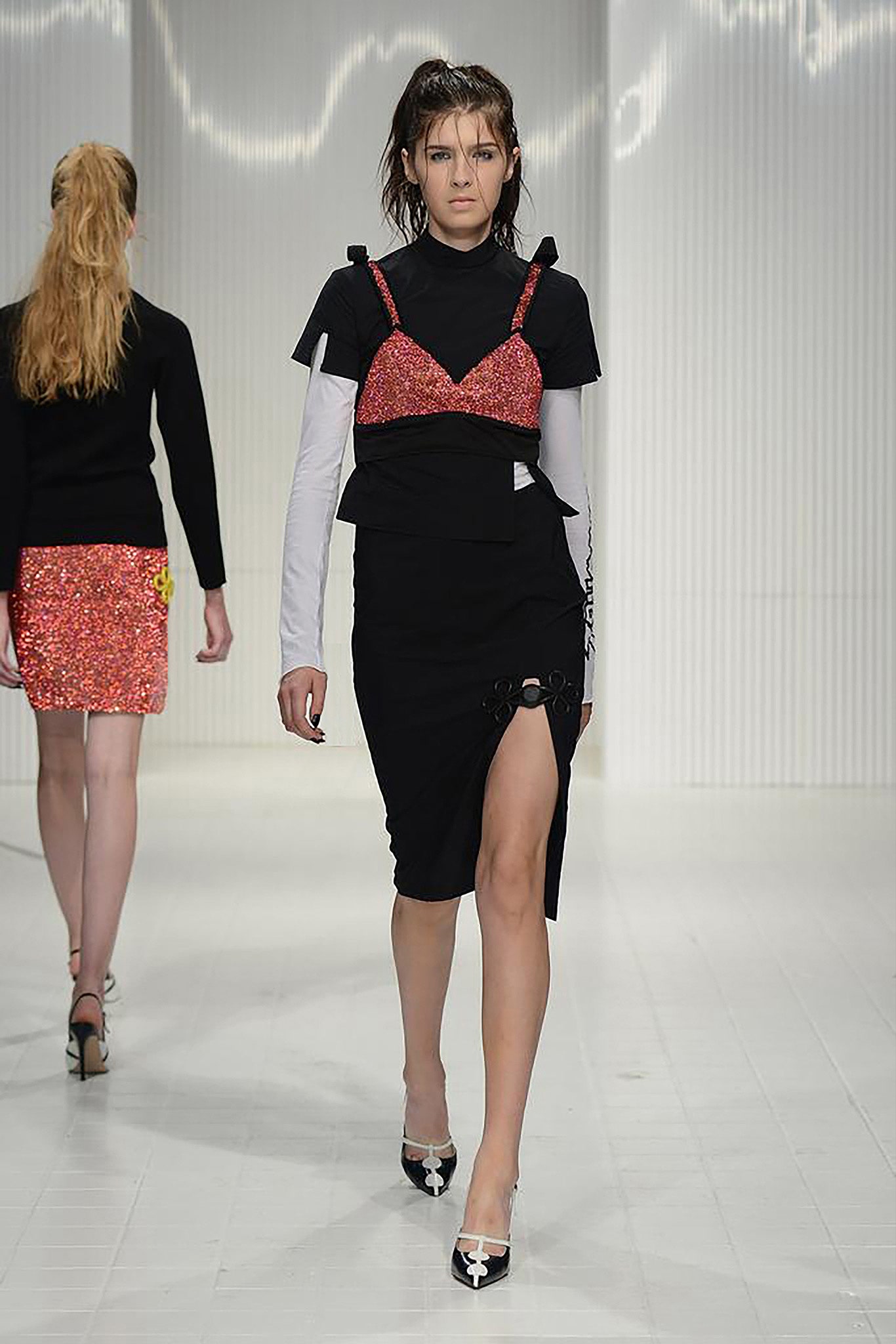 black fitted top and dress with sequined bra