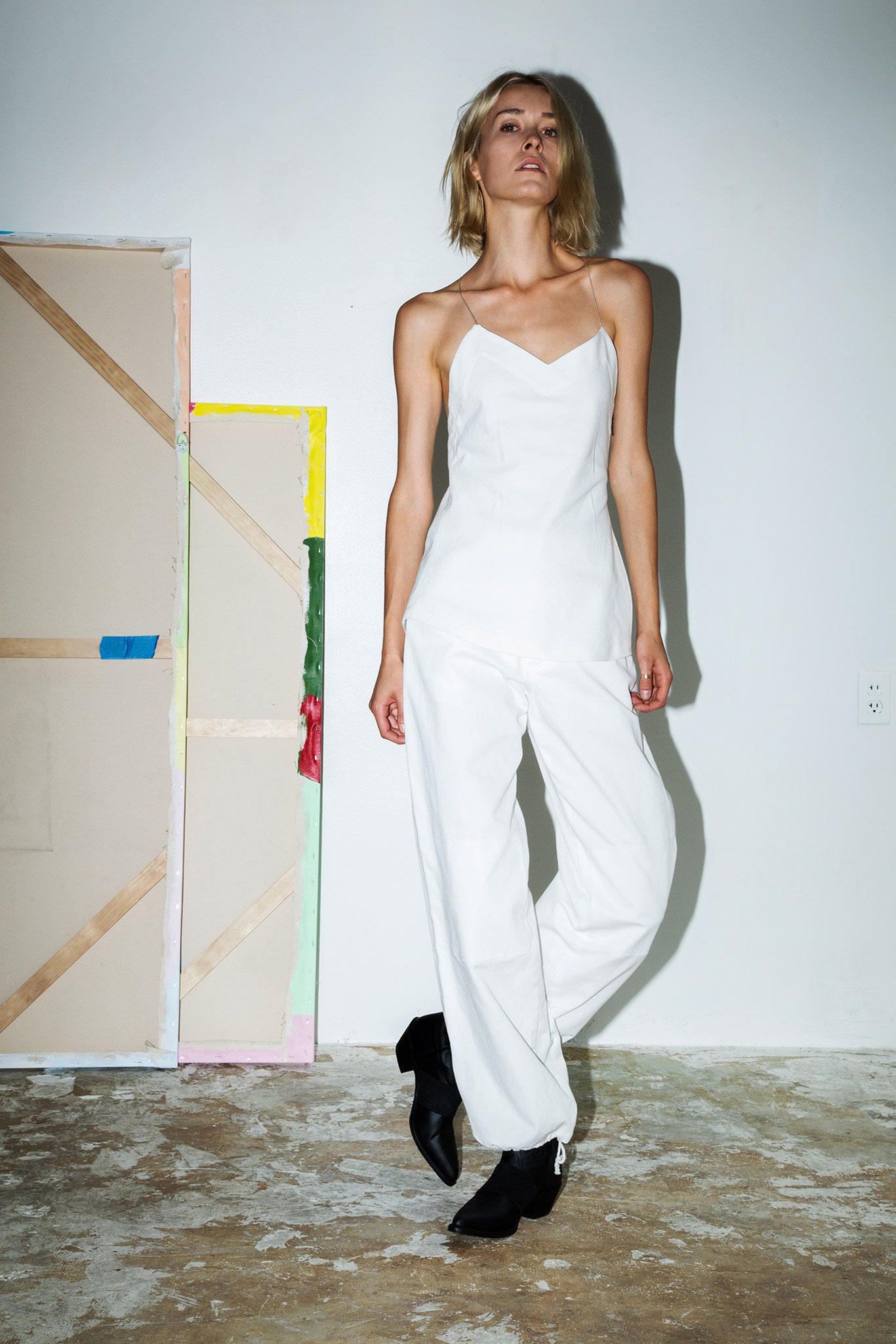 white cotton sleeveless v-neck fitted straight-leg jumpsuit